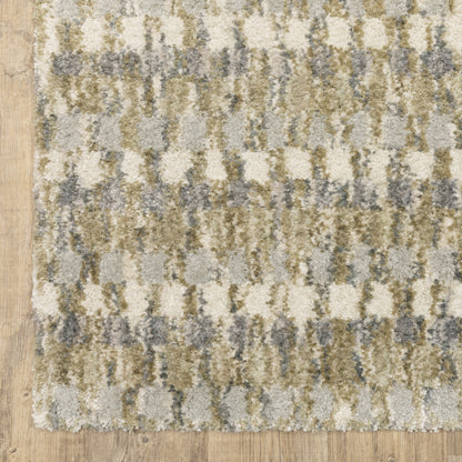 Oriental Weavers Aspen 3052A plush shag rug featuring abstract pattern in gold/ grey tones