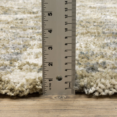Oriental Weavers Aspen 3052A plush shag rug featuring abstract pattern in gold/ grey tones