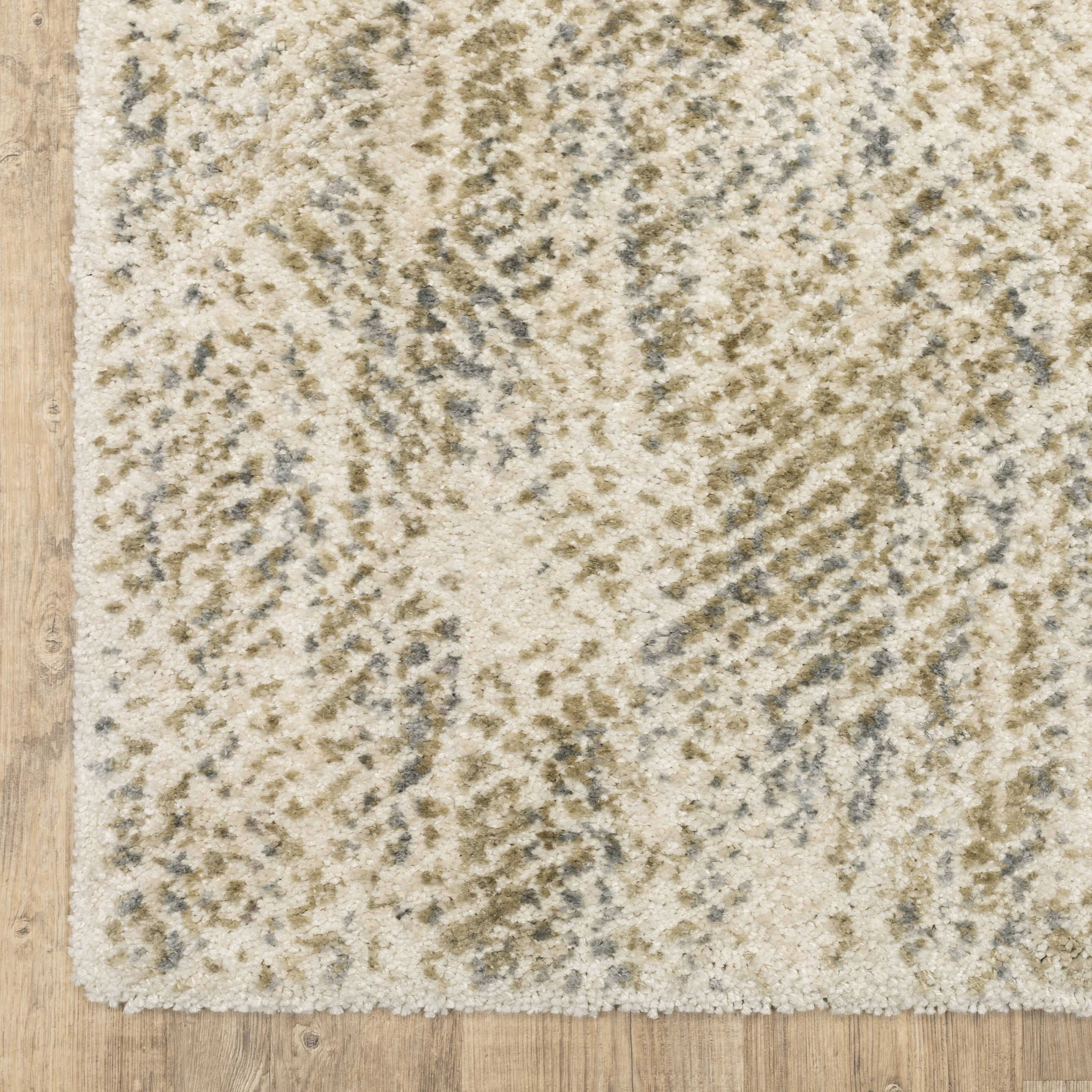 Oriental Weavers Aspen 3154E plush shag rug featuring abstract pattern in ivory/ gold tones