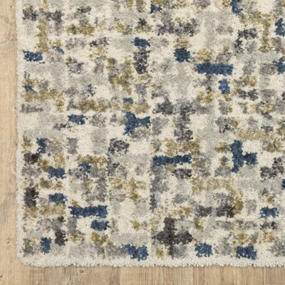 Oriental Weavers Aspen 3514A plush shag rug featuring abstract pattern in ivory/ blue tones