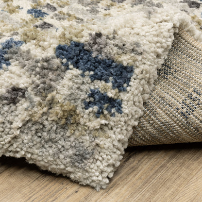Oriental Weavers Aspen 3514A plush shag rug featuring abstract pattern in ivory/ blue tones
