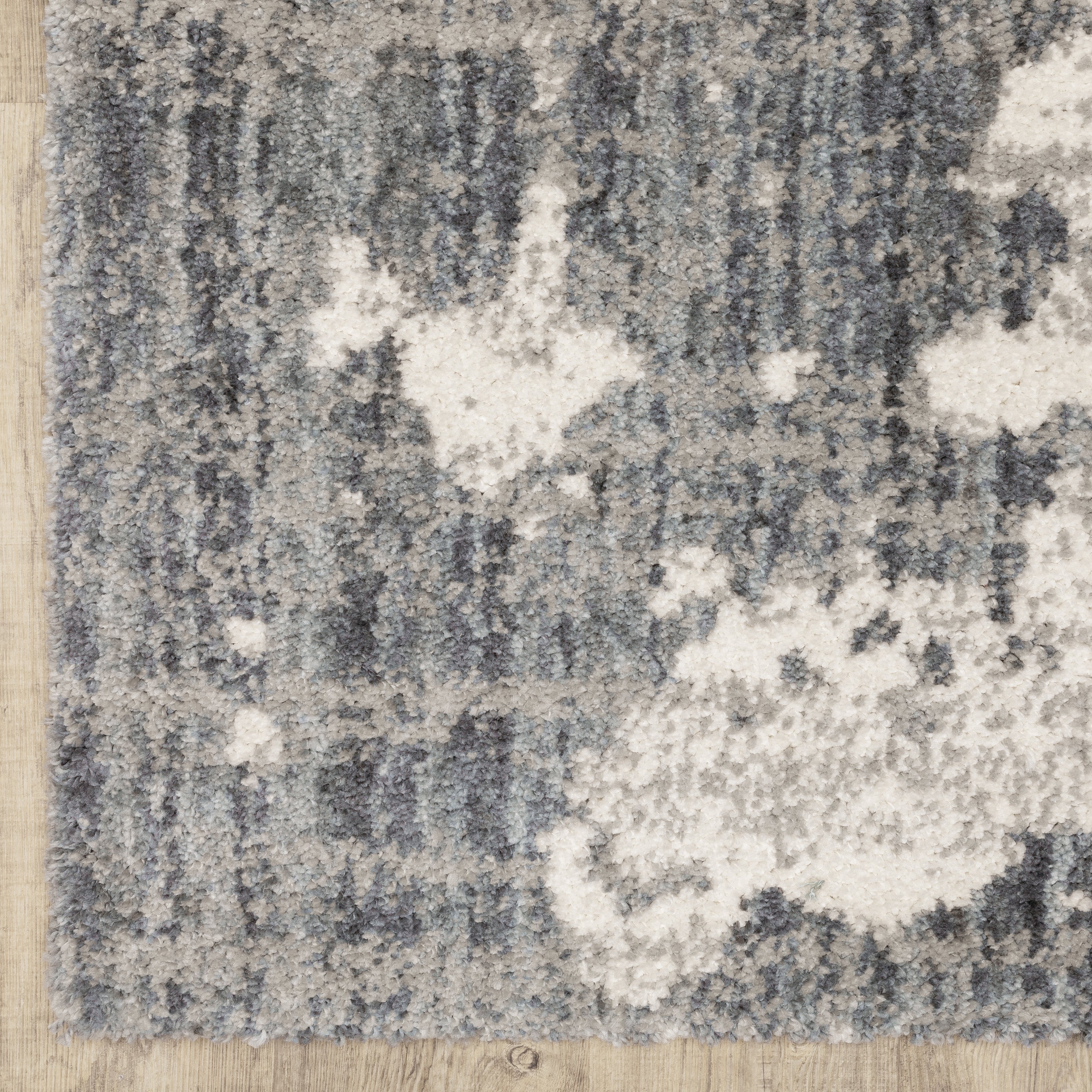 Oriental Weavers Aspen 003H9 plush shag rug featuring abstract pattern in grey/ ivory tones