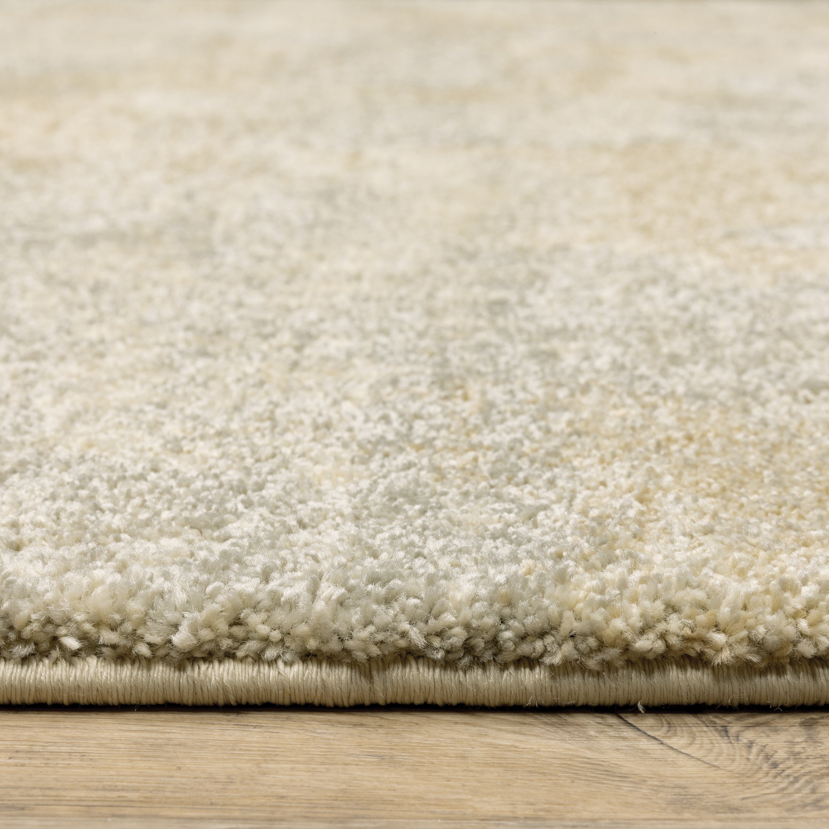 Oriental Weavers Astor 2268J plush modern rug featuring abstract pattern in beige/ grey tones