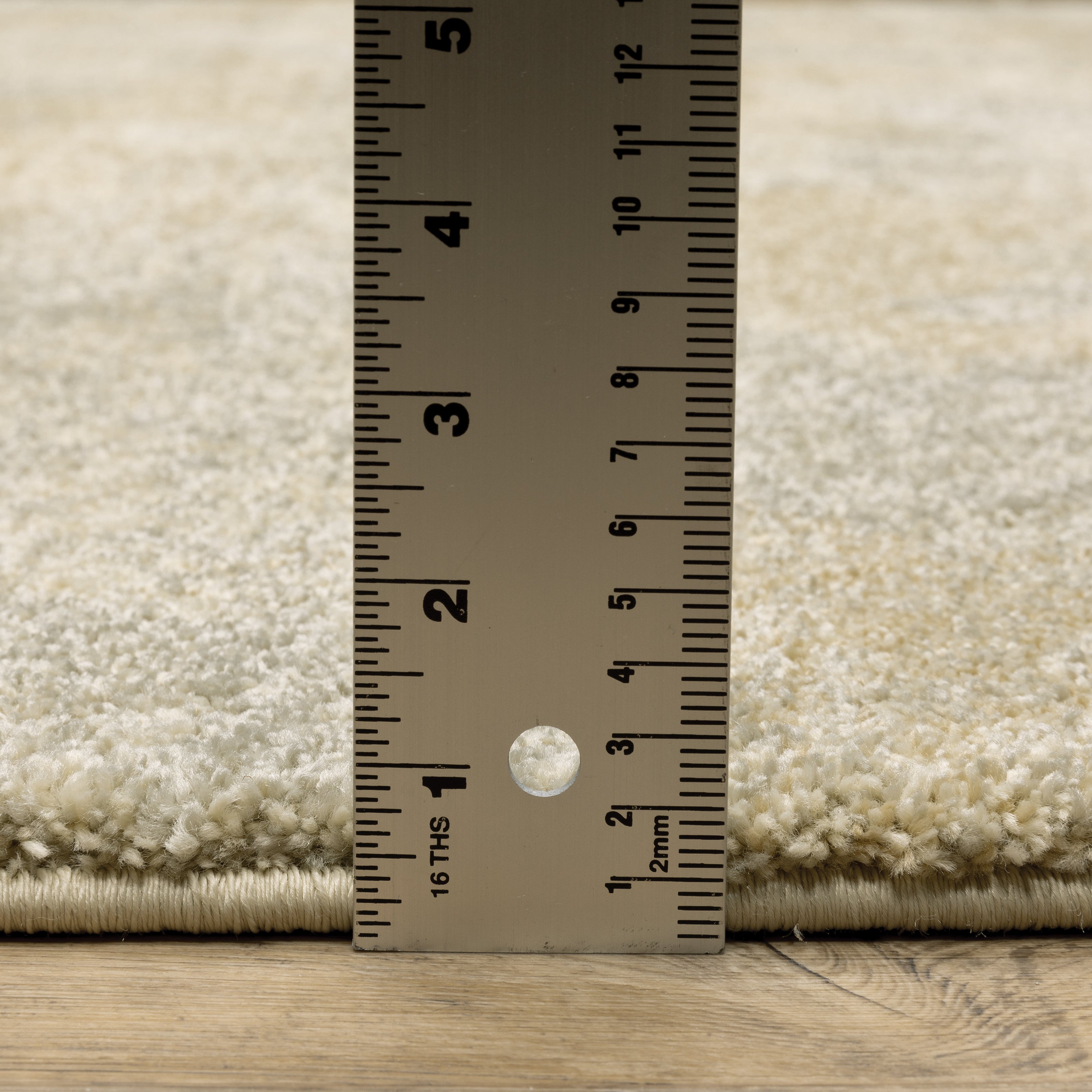 Oriental Weavers Astor 2268J plush modern rug featuring abstract pattern in beige/ grey tones