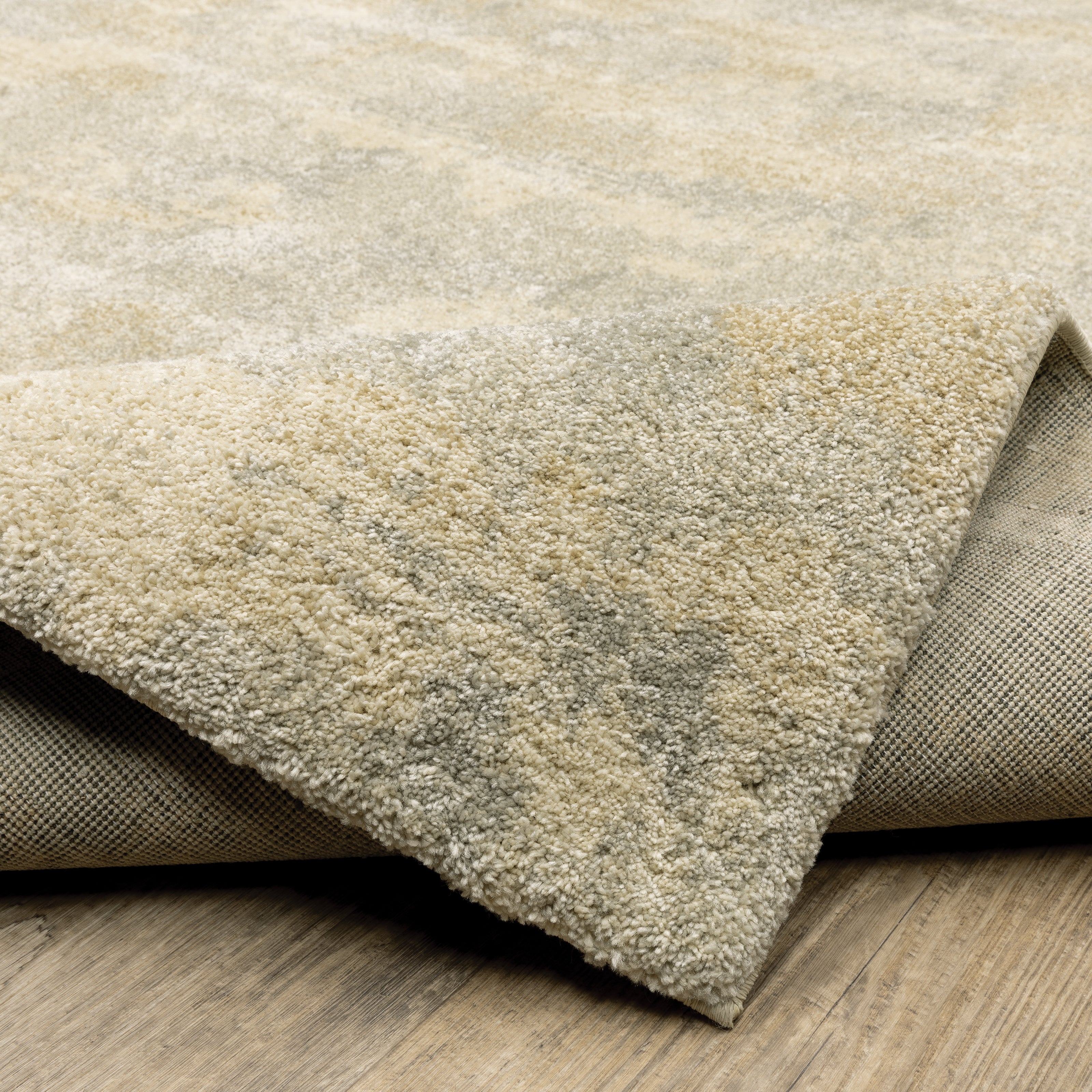 Oriental Weavers Astor 2268J plush modern rug featuring abstract pattern in beige/ grey tones