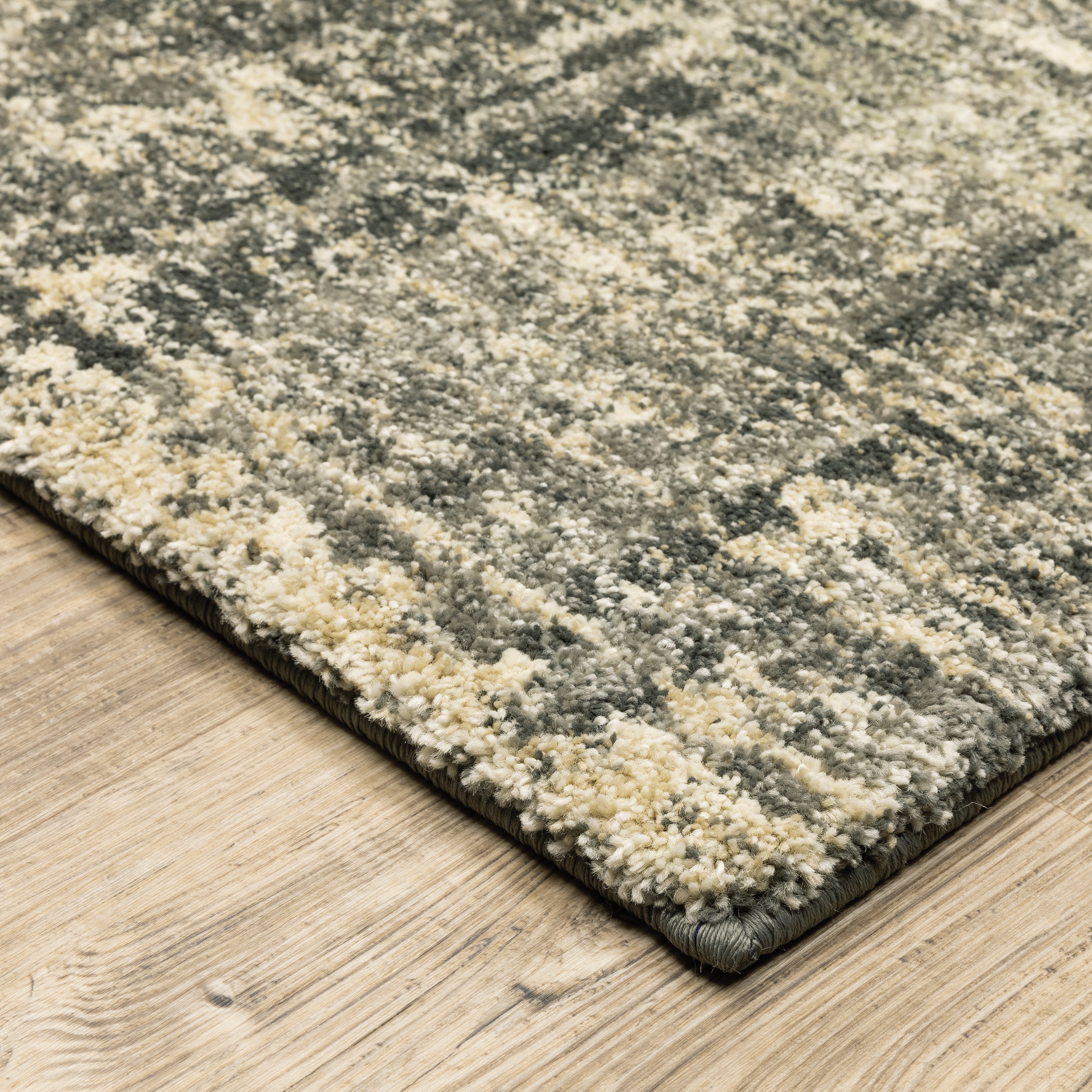 Oriental Weavers Astor 2541M plush modern rug featuring abstract pattern in charcoal/ beige tones