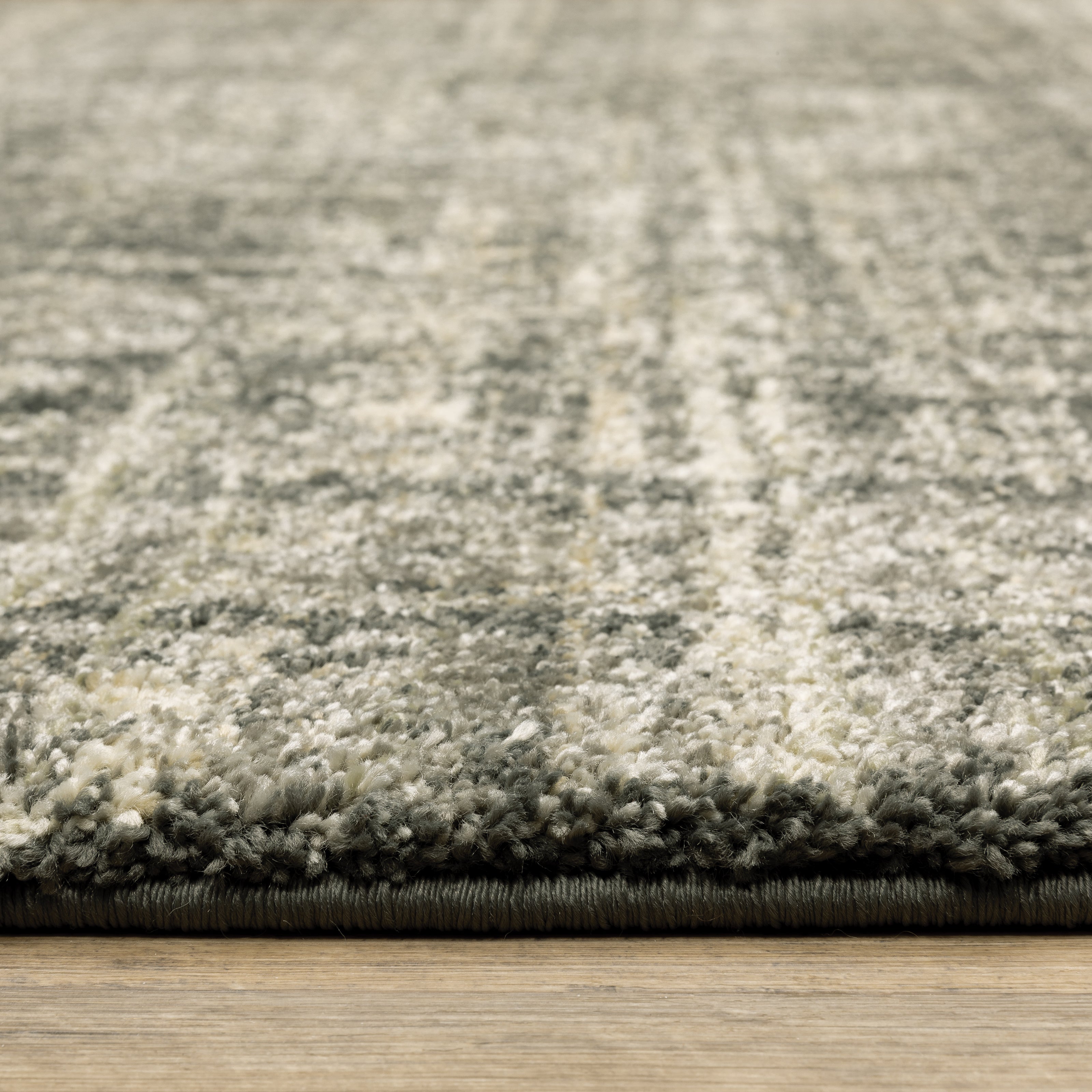 Oriental Weavers Astor 2541M plush modern rug featuring abstract pattern in charcoal/ beige tones