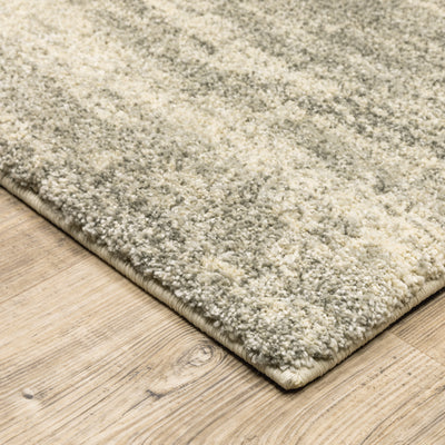 Oriental Weavers Astor 5572E plush modern rug featuring abstract pattern in grey/ beige tones