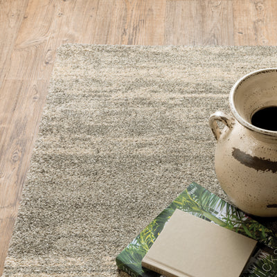 Oriental Weavers Astor 5572E plush modern rug featuring abstract pattern in grey/ beige tones