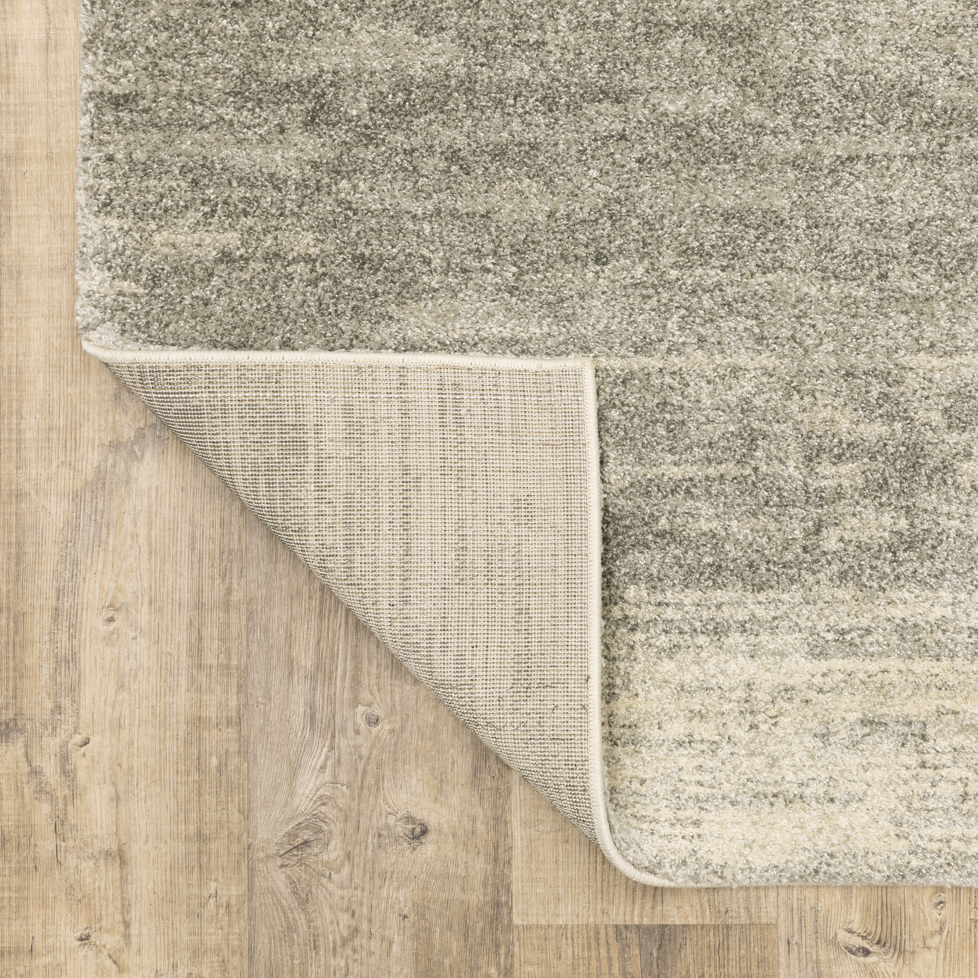 Oriental Weavers Astor 5572E plush modern rug featuring abstract pattern in grey/ beige tones