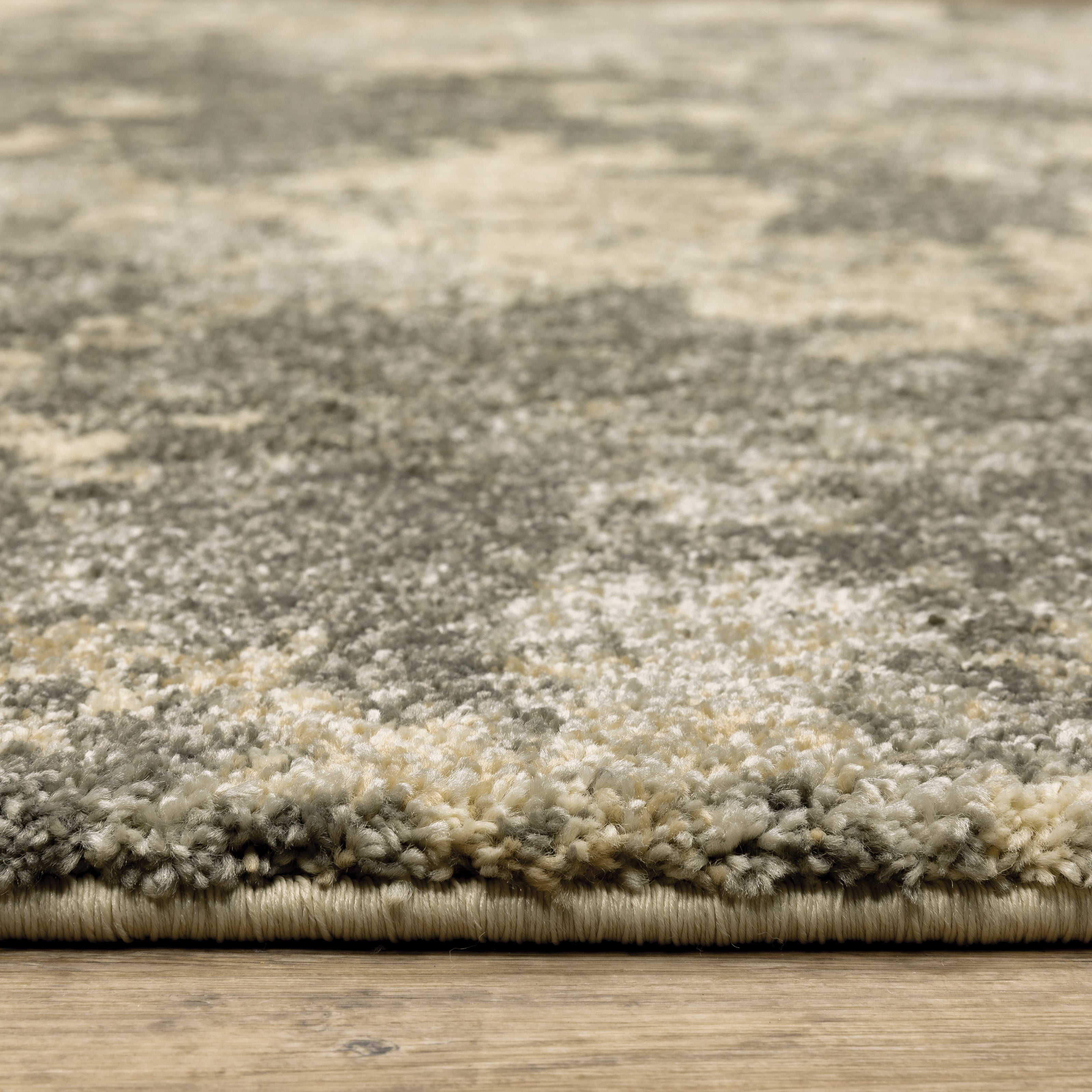 Oriental Weavers Astor 7150D plush modern rug featuring abstract pattern in grey/ beige tones