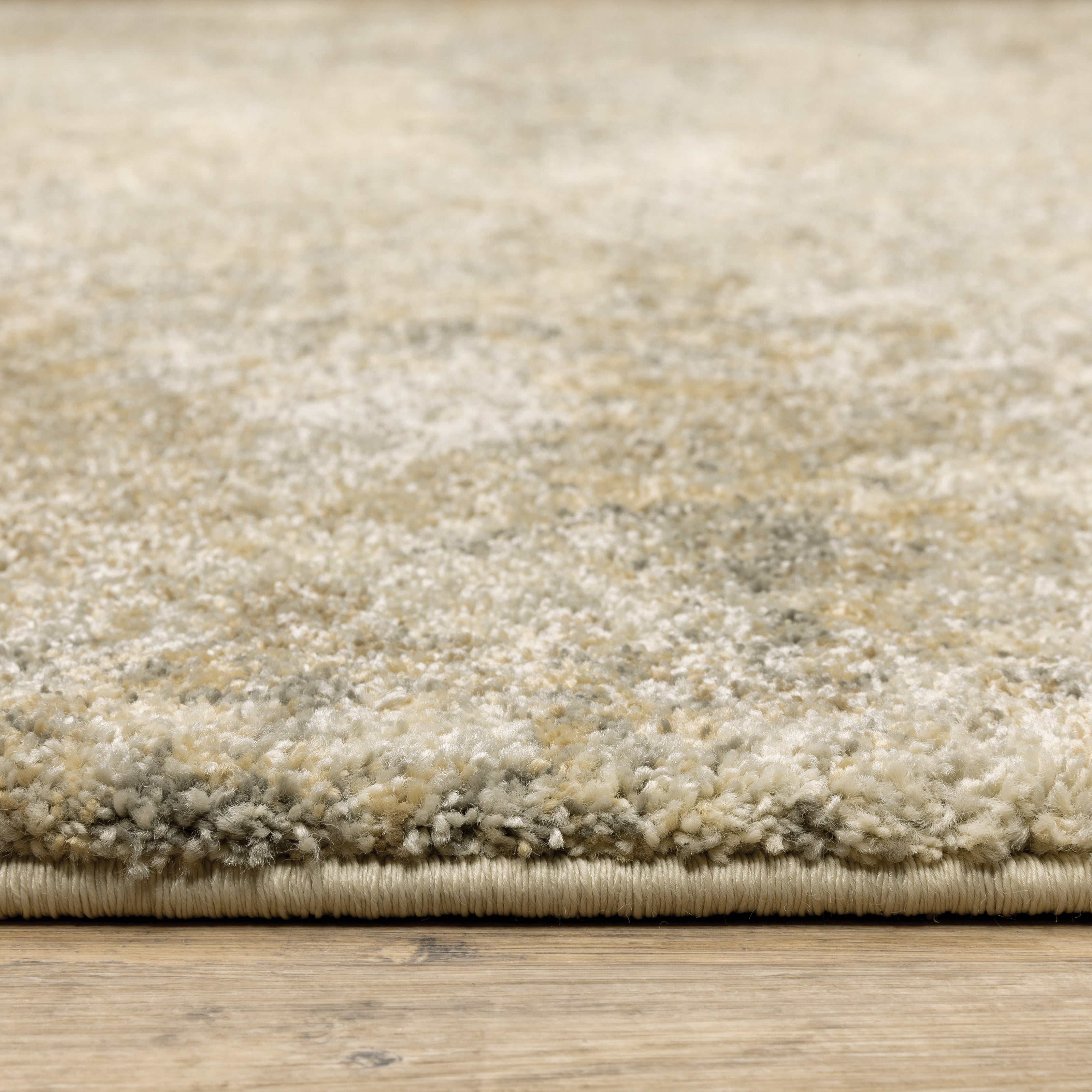 Oriental Weavers Astor 8322J plush modern rug featuring abstract pattern in gold/ beige tones