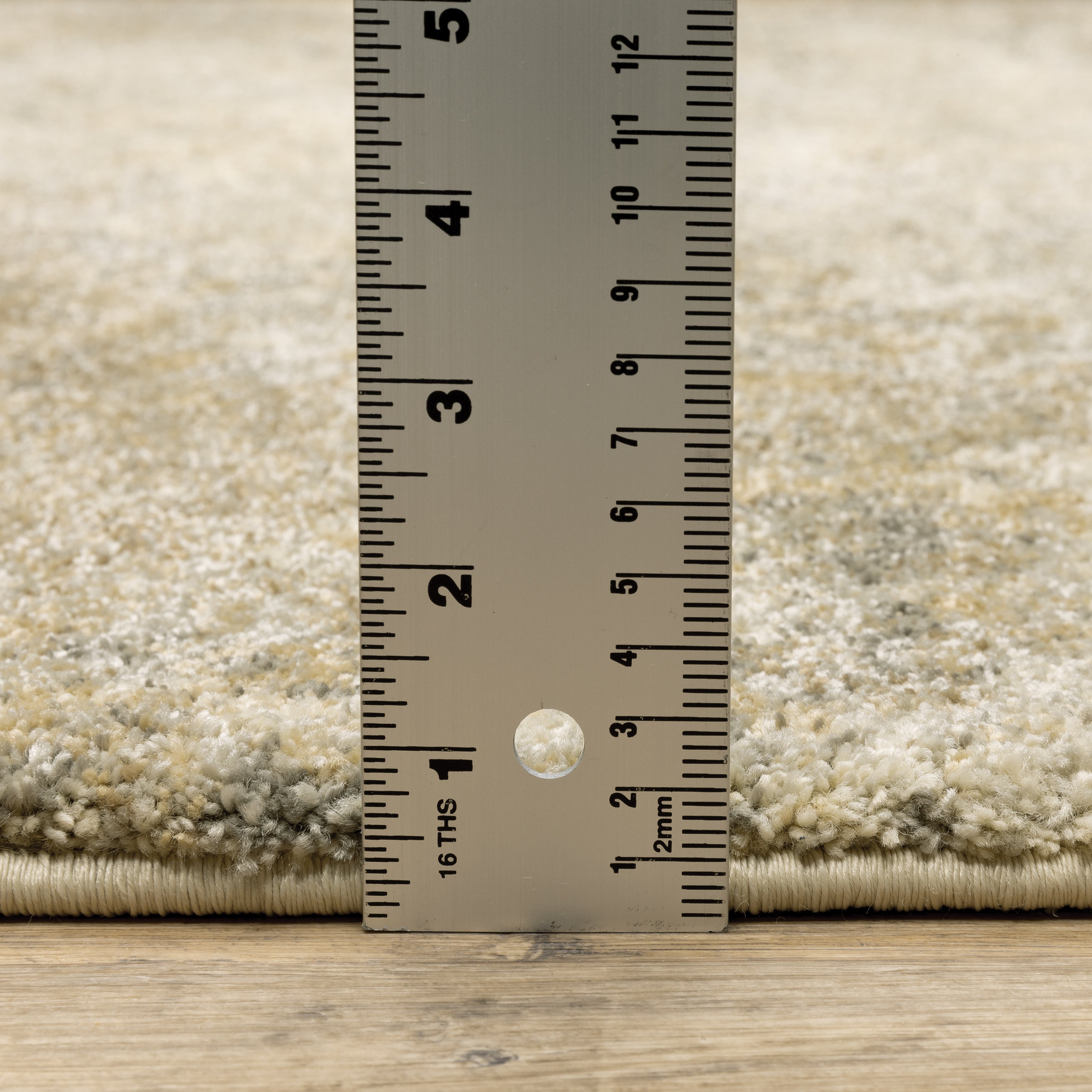 Oriental Weavers Astor 8322J plush modern rug featuring abstract pattern in gold/ beige tones