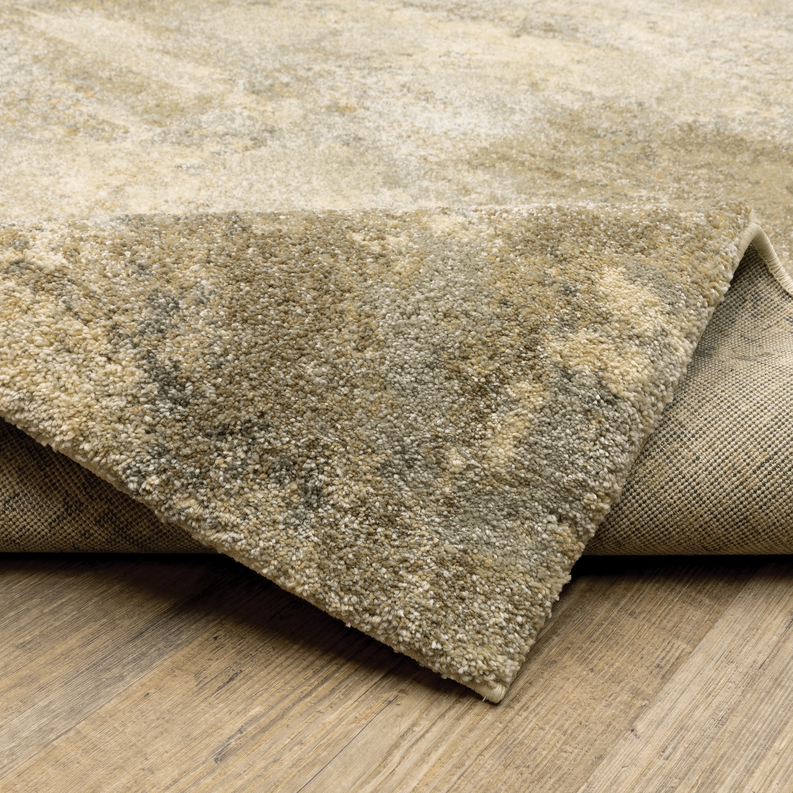 Oriental Weavers Astor 8322J plush modern rug featuring abstract pattern in gold/ beige tones