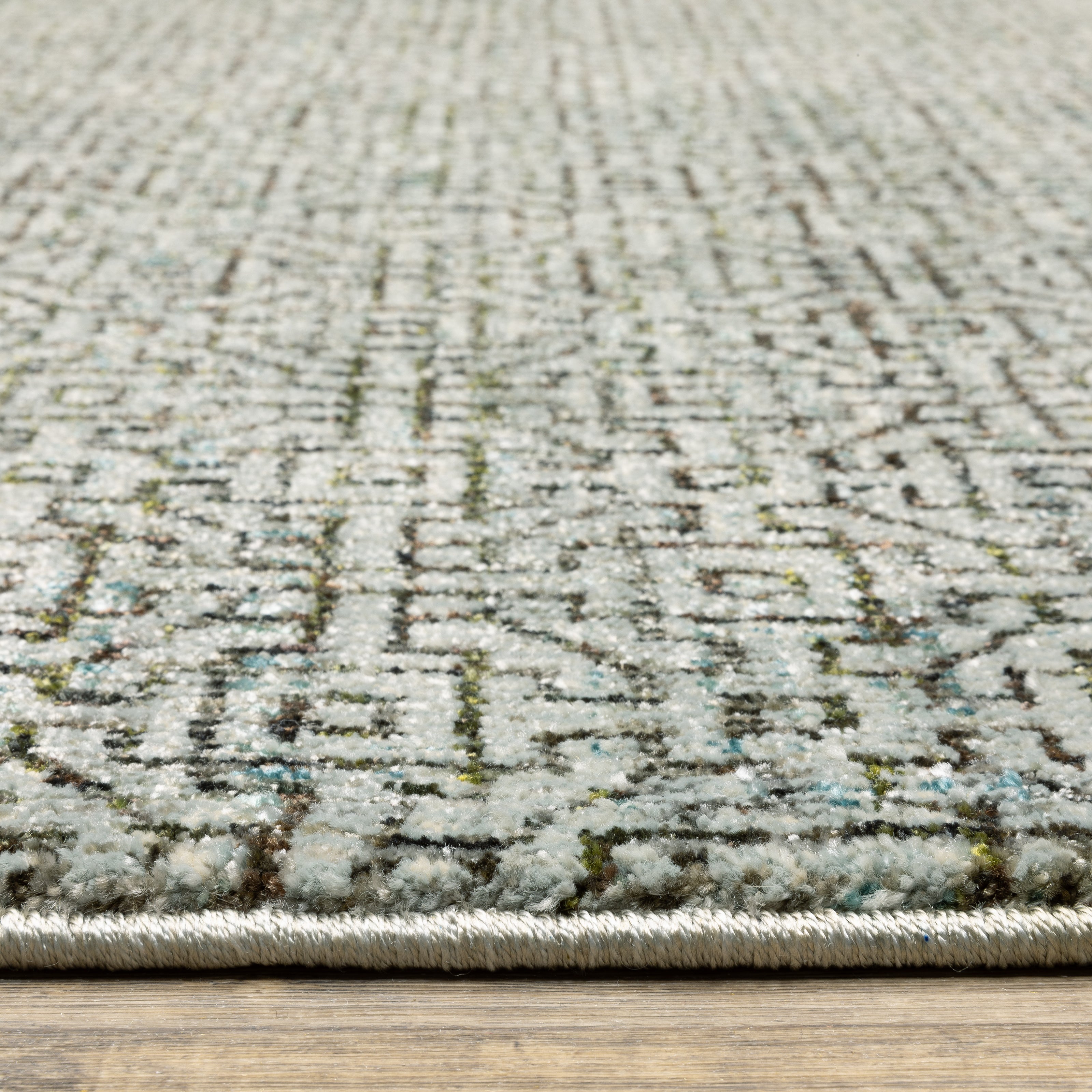 Oriental Weavers Atlas 3721J textured area rug featuring textured design in blue/ brown tones