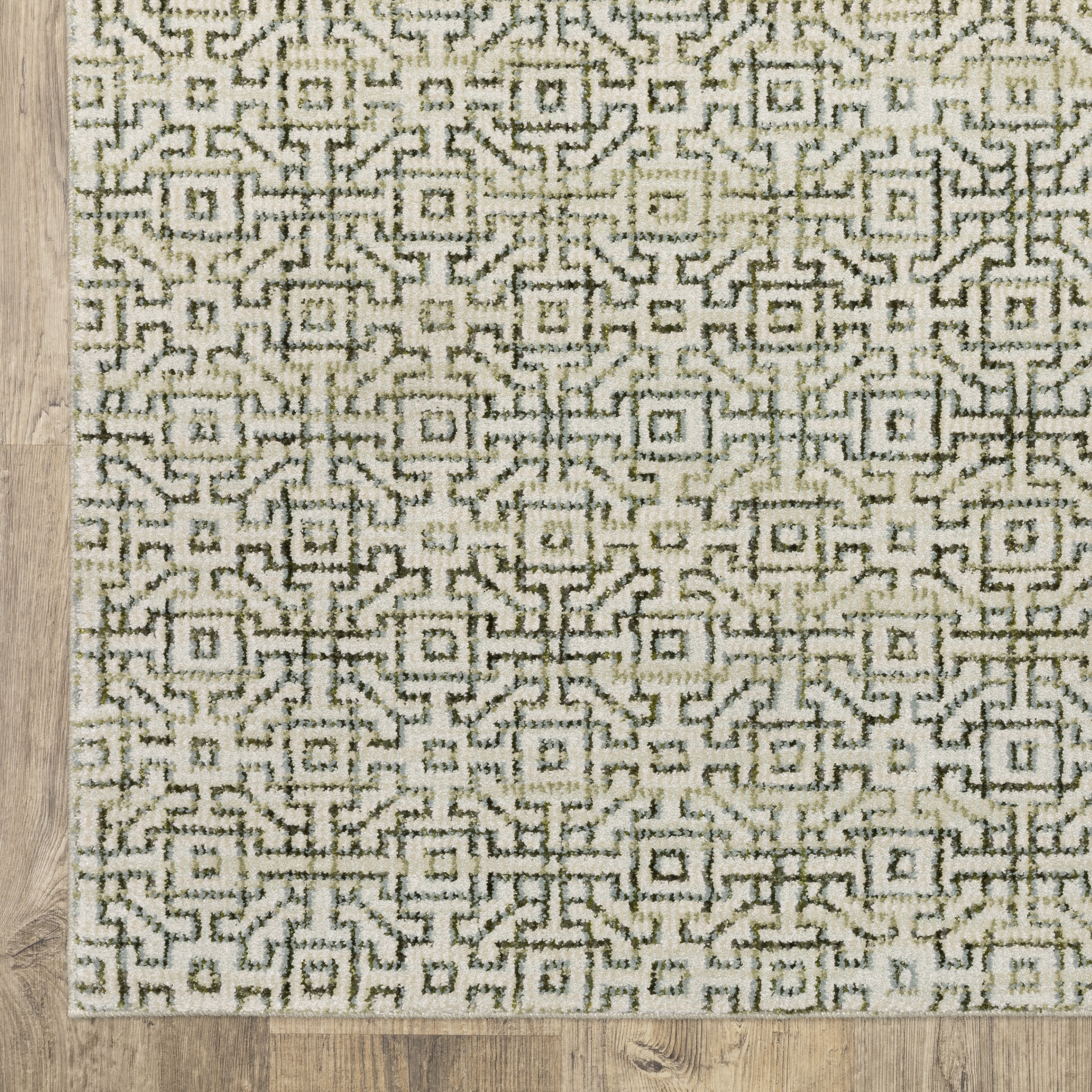 Oriental Weavers Atlas 3721K textured area rug featuring textured design in ivory/ green tones