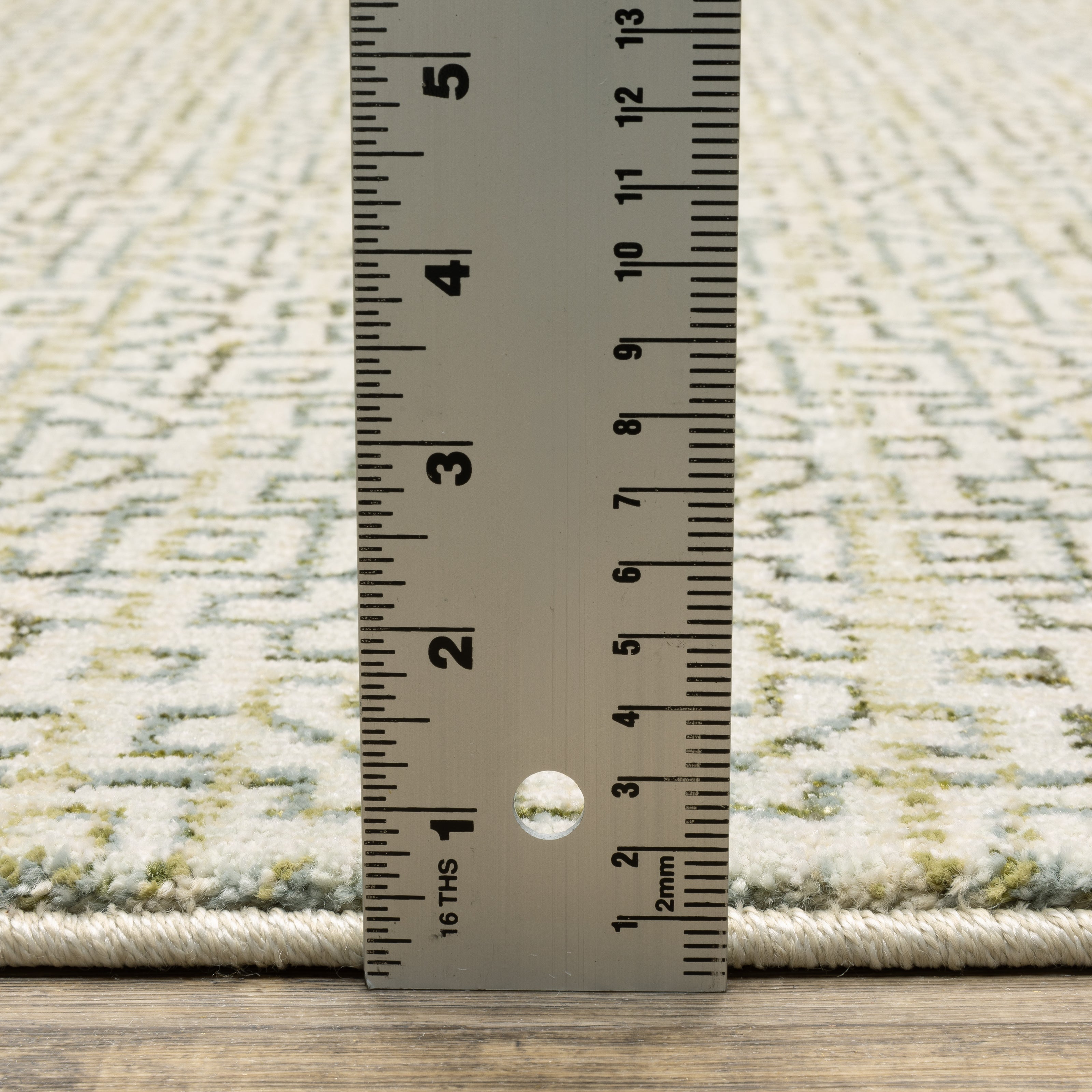 Oriental Weavers Atlas 3721K textured area rug featuring textured design in ivory/ green tones