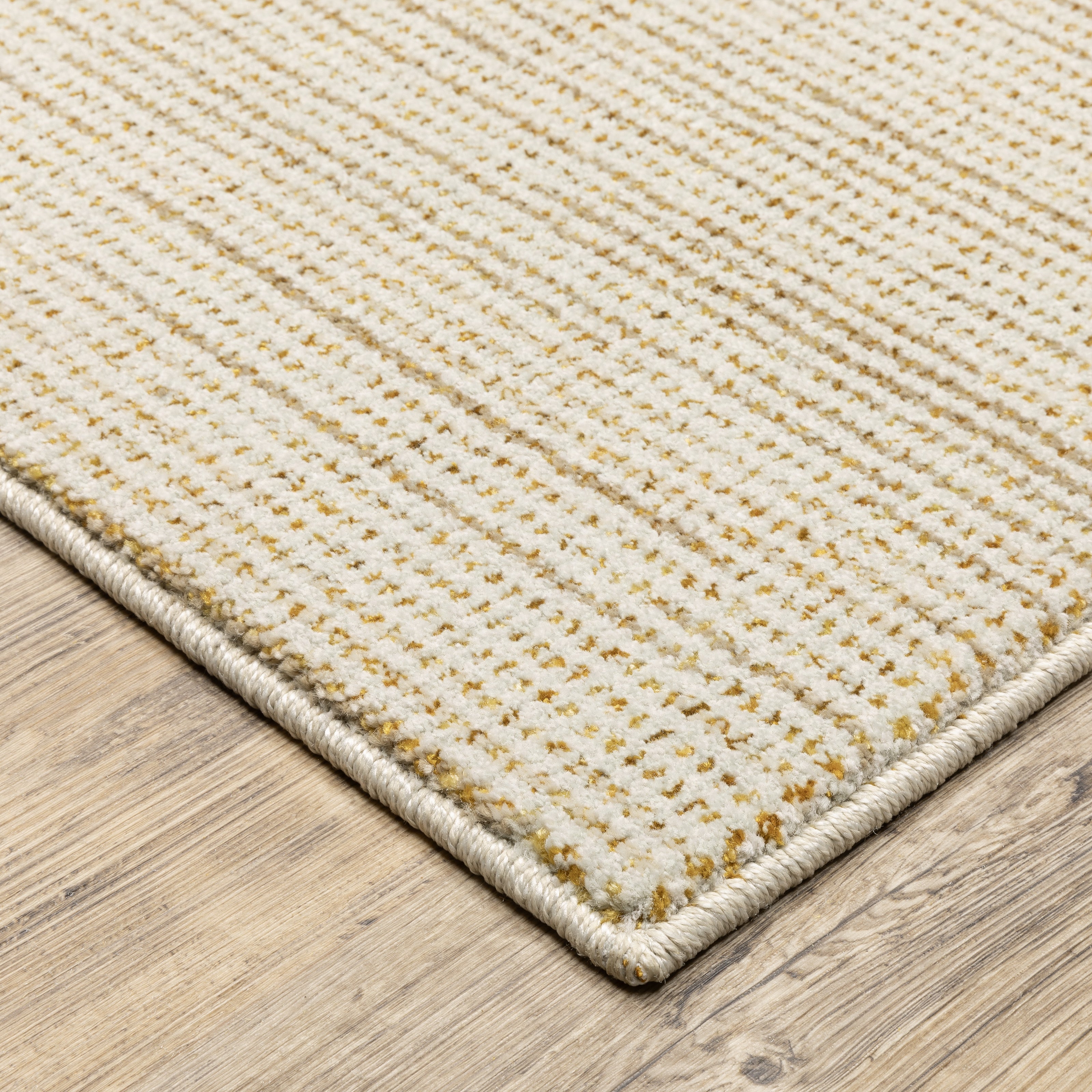 Oriental Weavers Atlas 3723N textured area rug featuring textured design in ivory/ gold tones