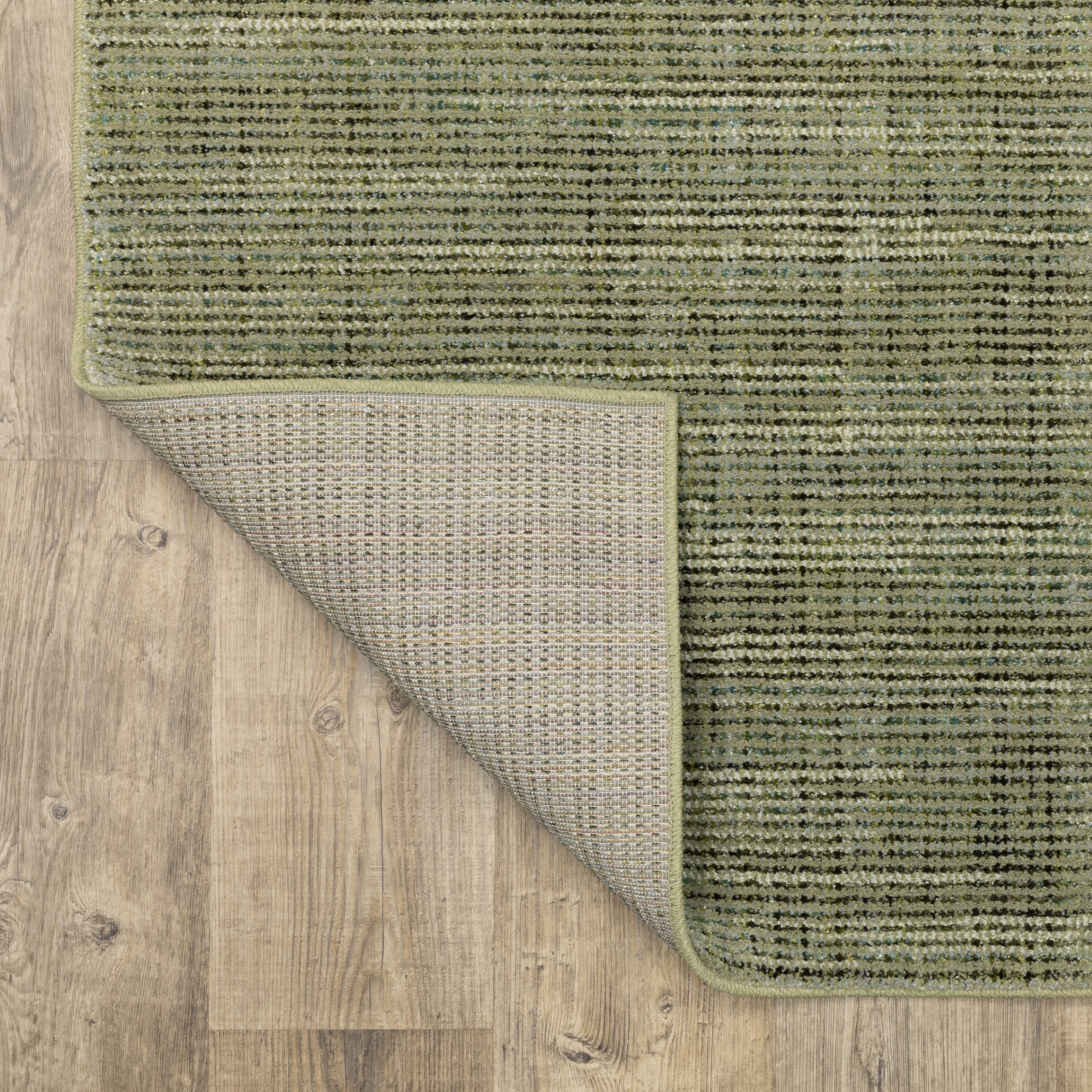 Oriental Weavers Atlas 3723R textured area rug featuring textured design in green/ blue tones