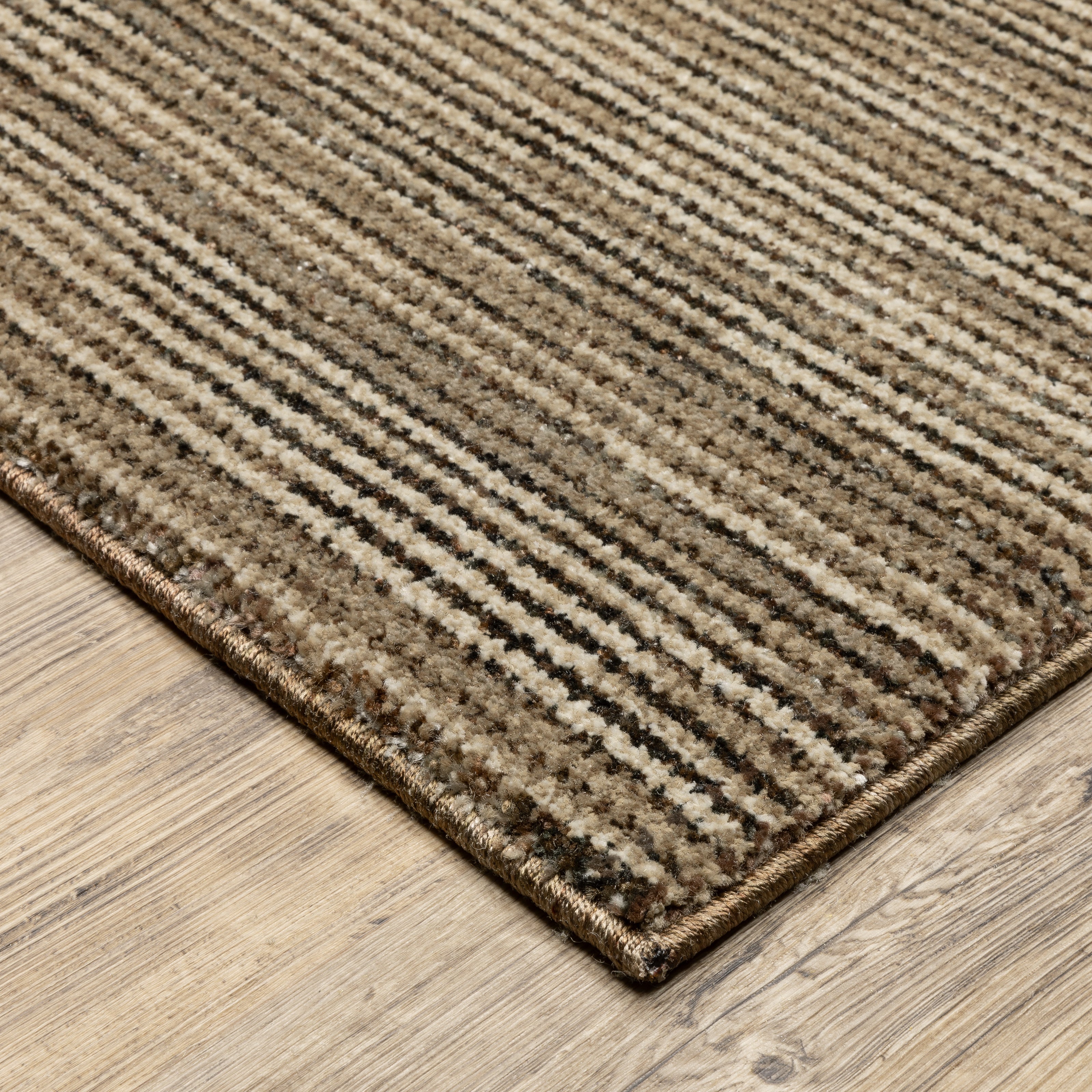 Oriental Weavers Atlas 3723T textured area rug featuring textured design in brown/ beige tones