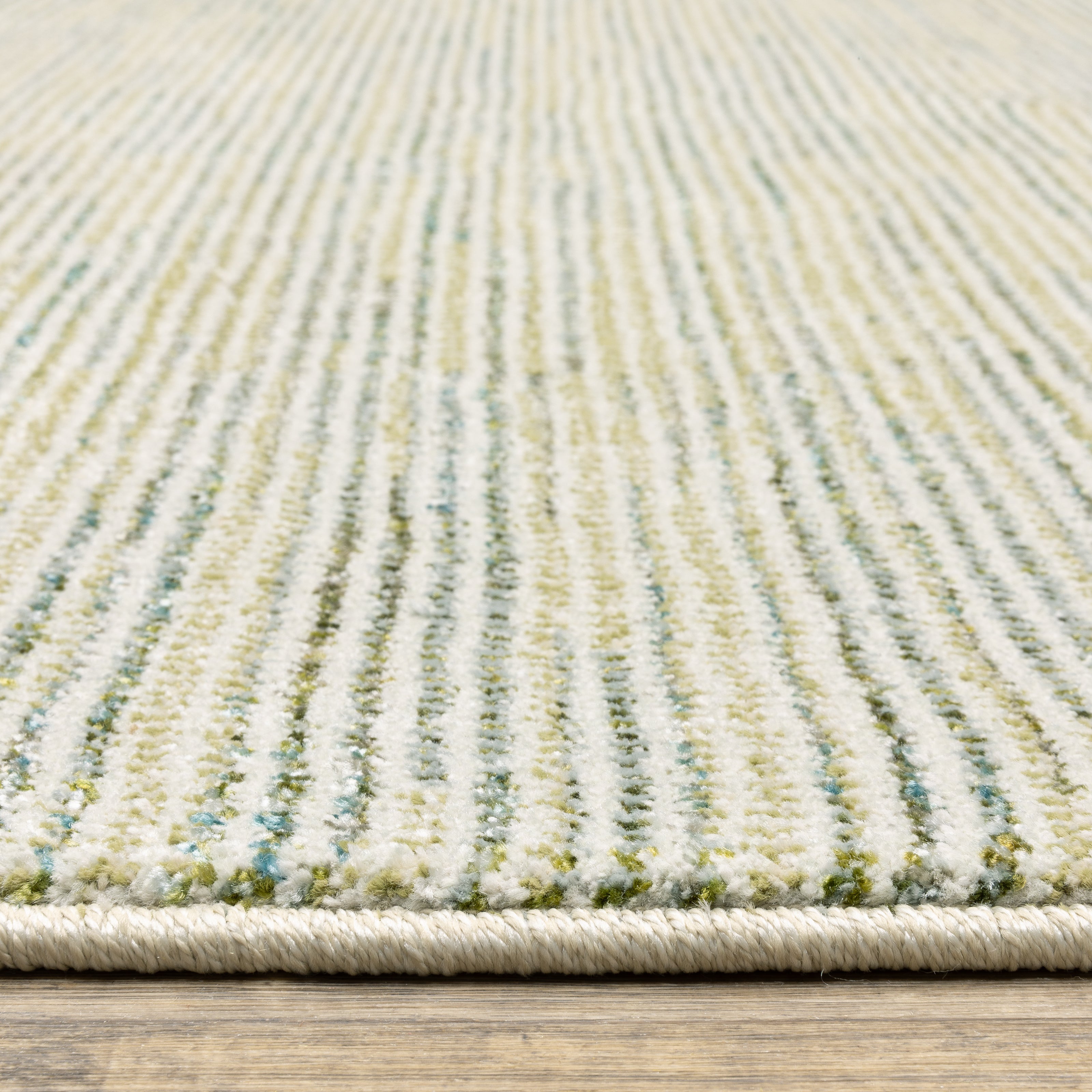 Oriental Weavers Atlas 3723U textured area rug featuring textured design in ivory/ blue tones