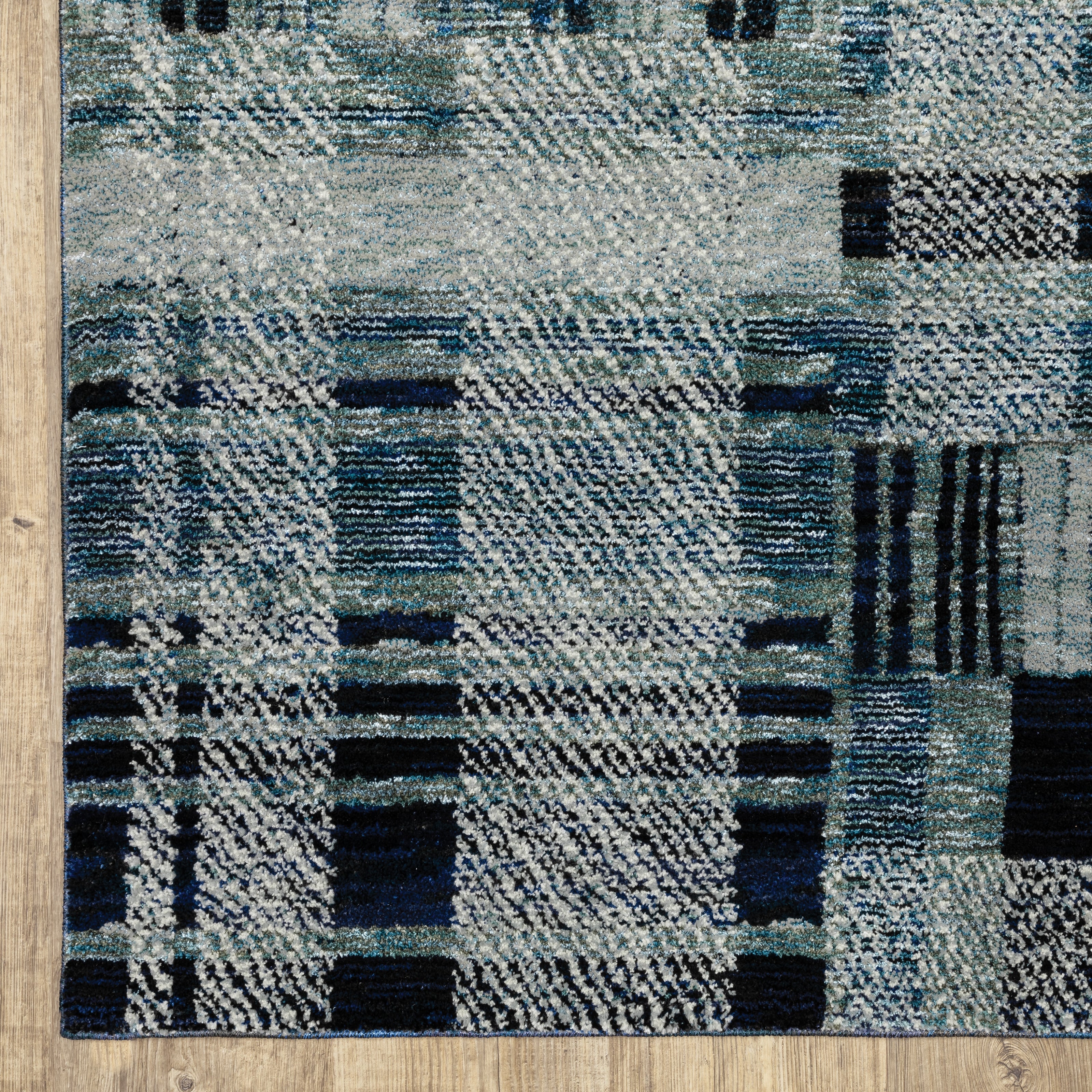 Oriental Weavers Atlas 752B0 textured area rug featuring textured design in blue tones