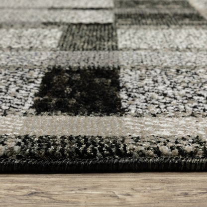 Oriental Weavers Atlas 752C0 textured area rug featuring textured design in black/ grey tones