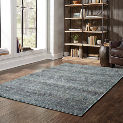 Oriental Weavers Atlas 8033J textured traditional rug featuring textured design in blue/ grey tones