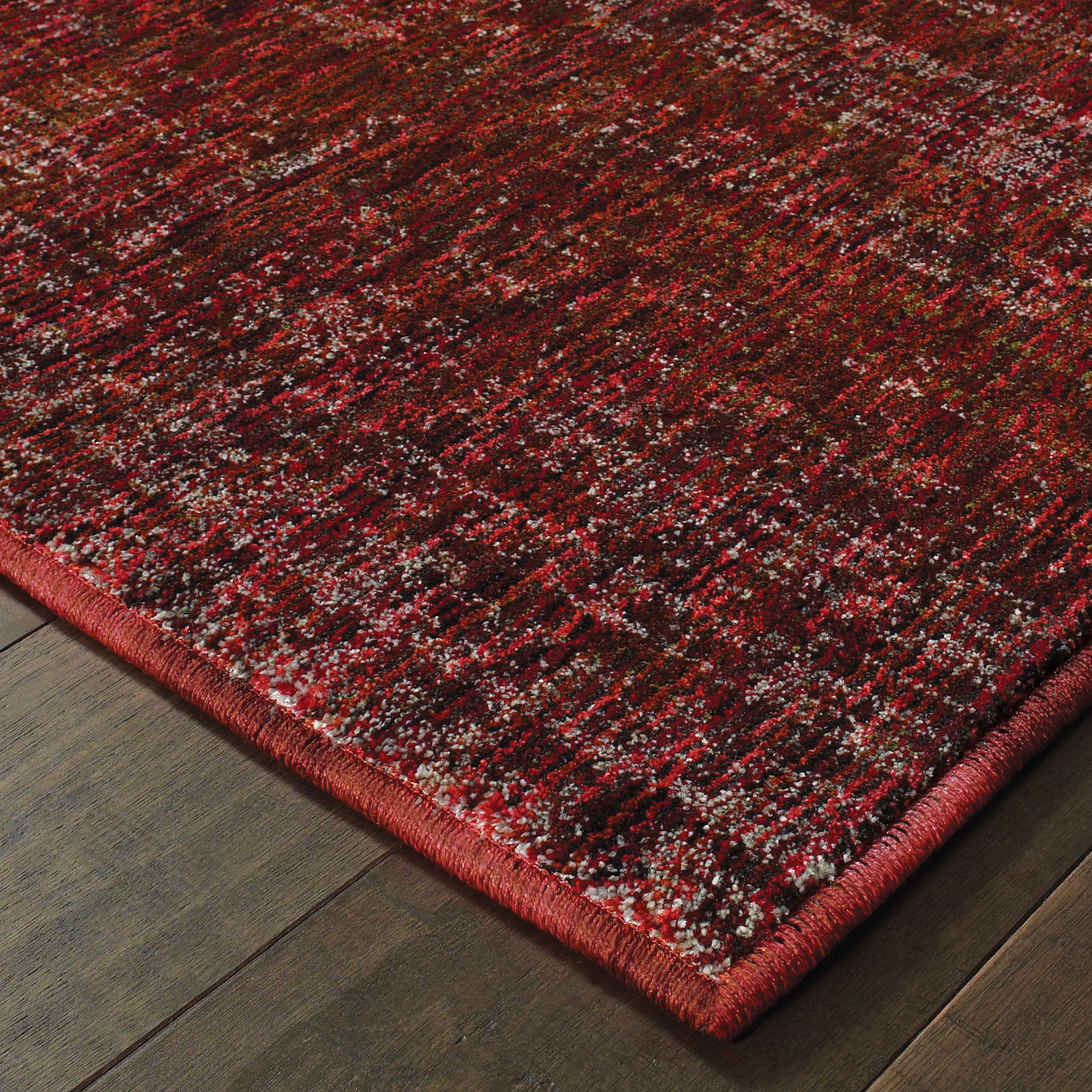 Oriental Weavers Atlas 8033K textured area rug featuring textured design in red/ rust tones