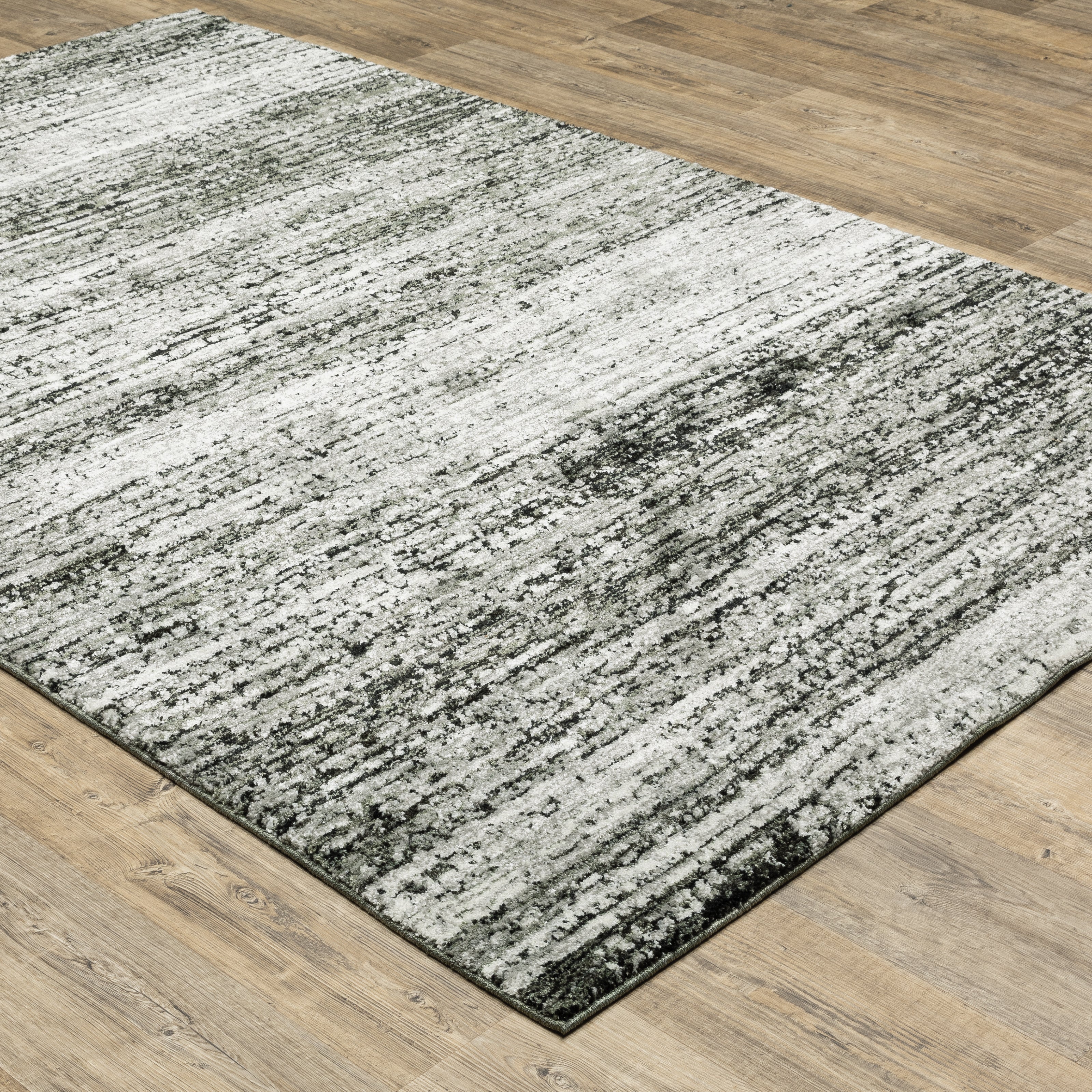 Oriental Weavers Atlas 8037G textured area rug featuring textured design in ash/ charcoal tones