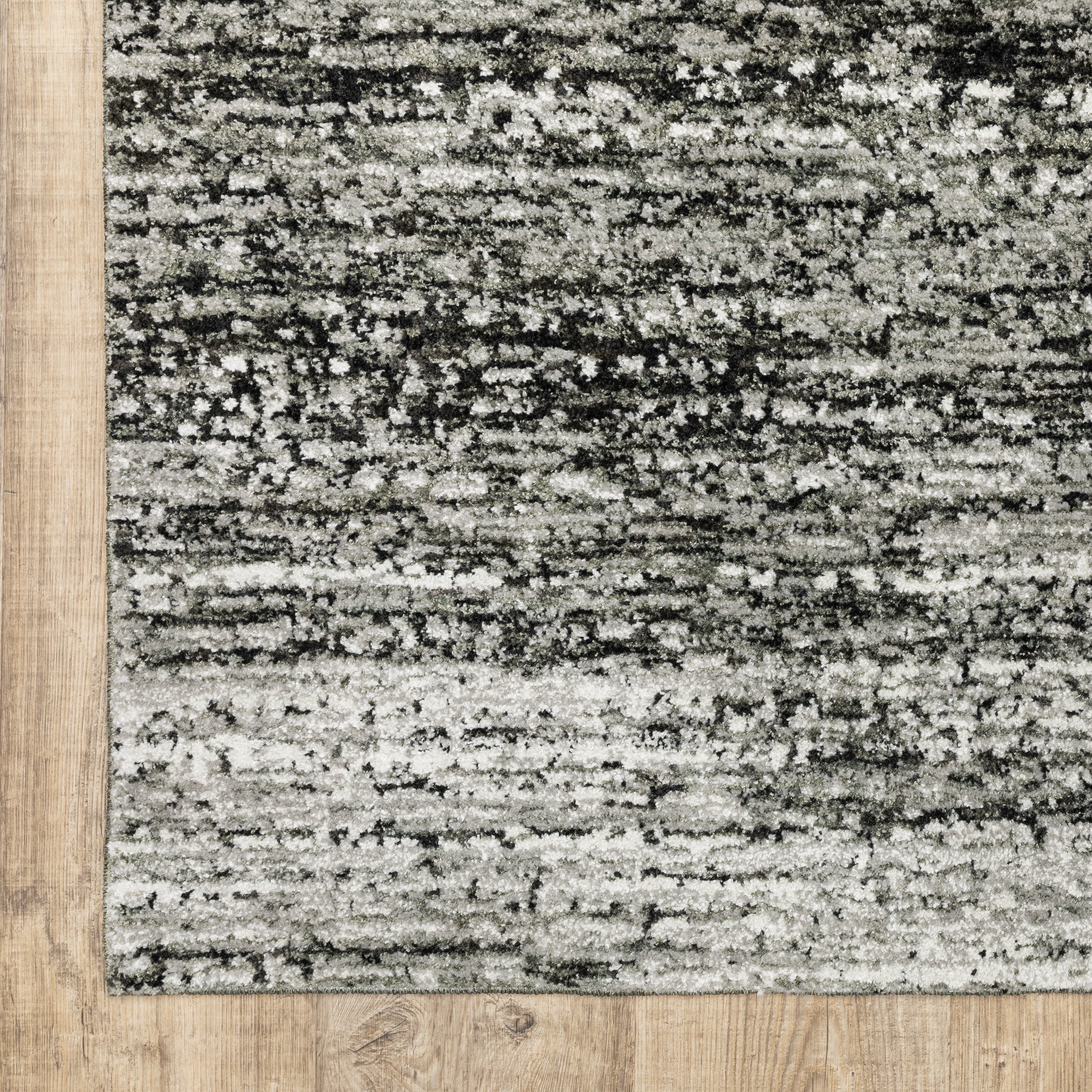 Oriental Weavers Atlas 8037G textured area rug featuring textured design in ash/ charcoal tones
