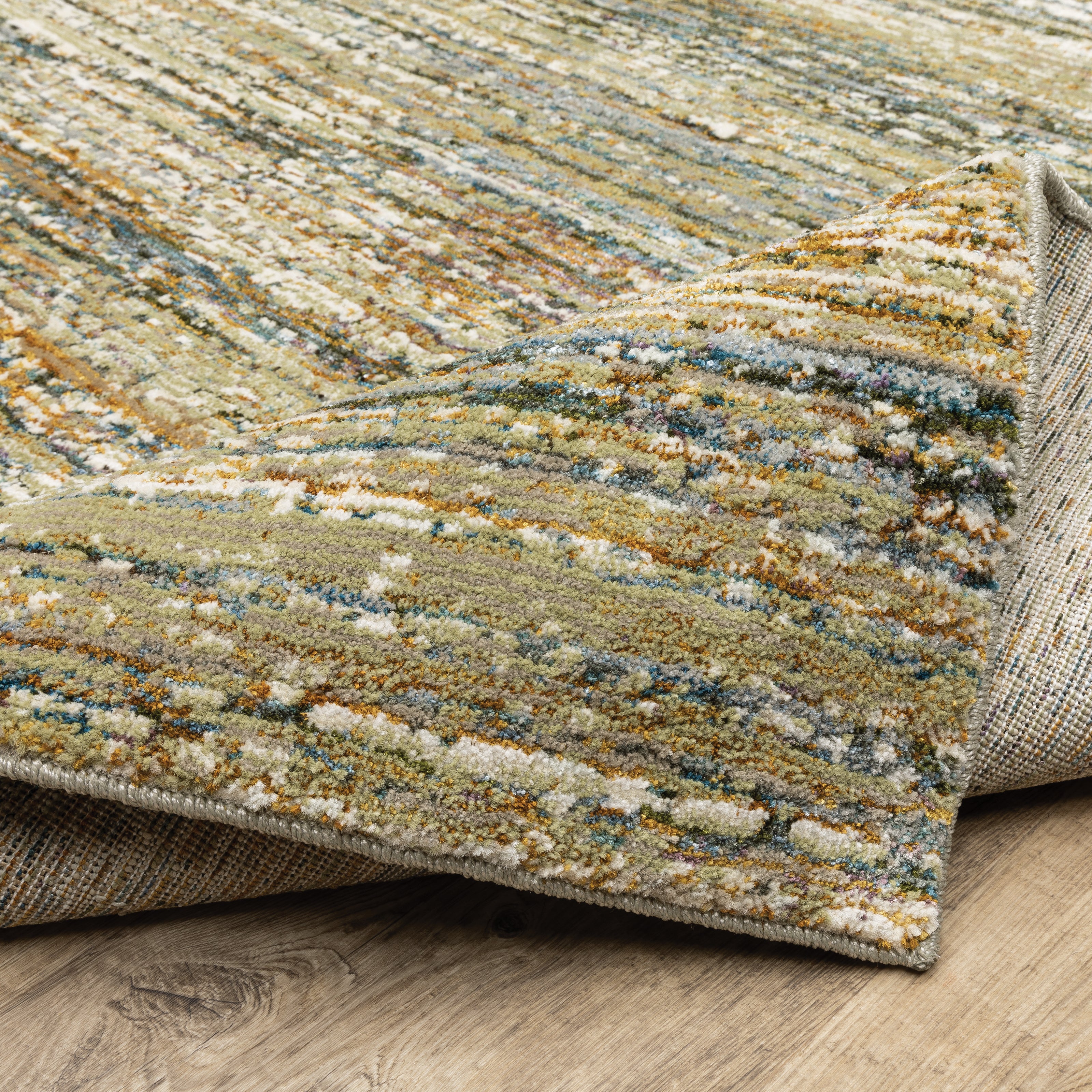 Oriental Weavers Atlas 8037J textured area rug featuring textured design in gold/ green tones