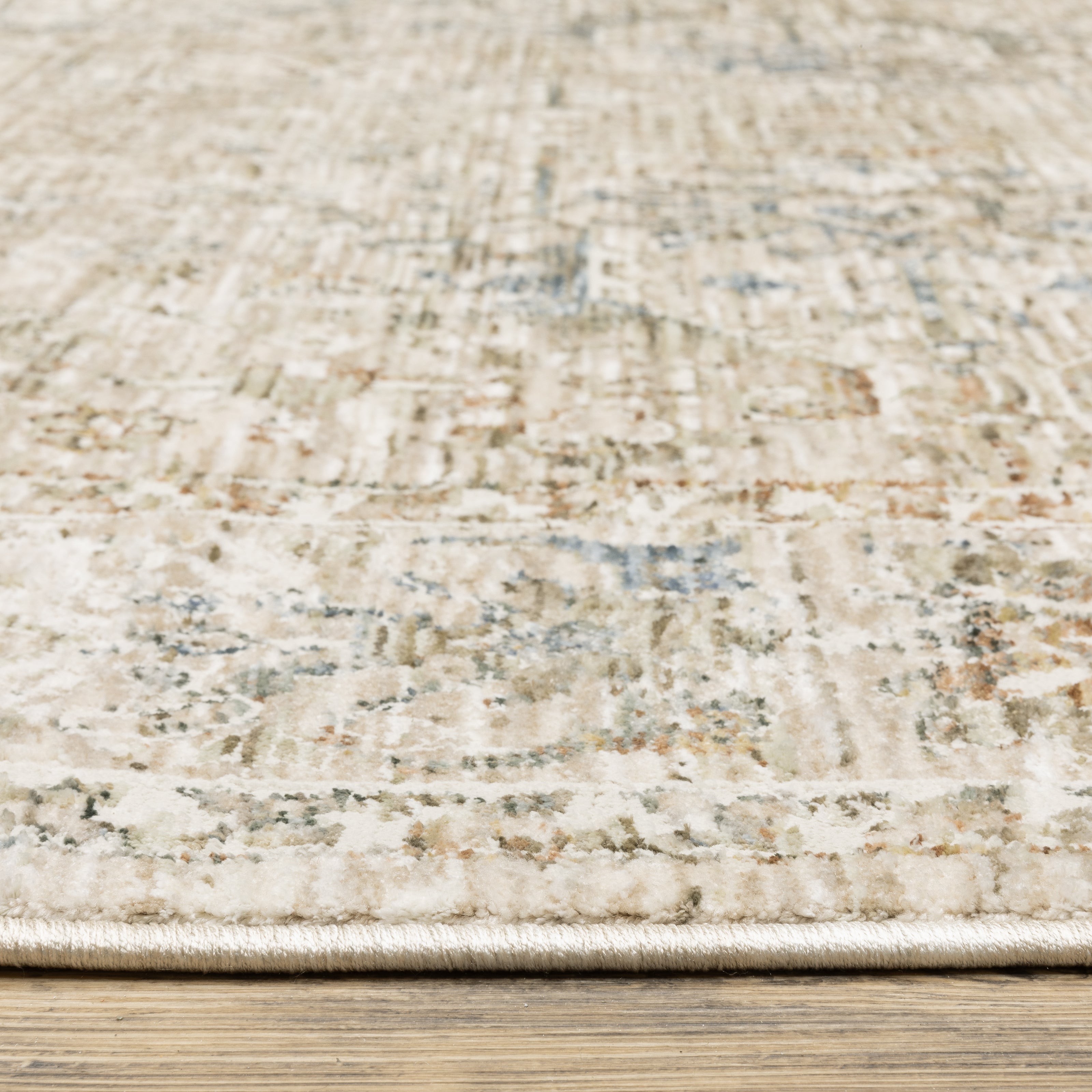 Oriental Weavers Avalon AVA02 soft transitional rug featuring decorative pattern in beige/ blue tones