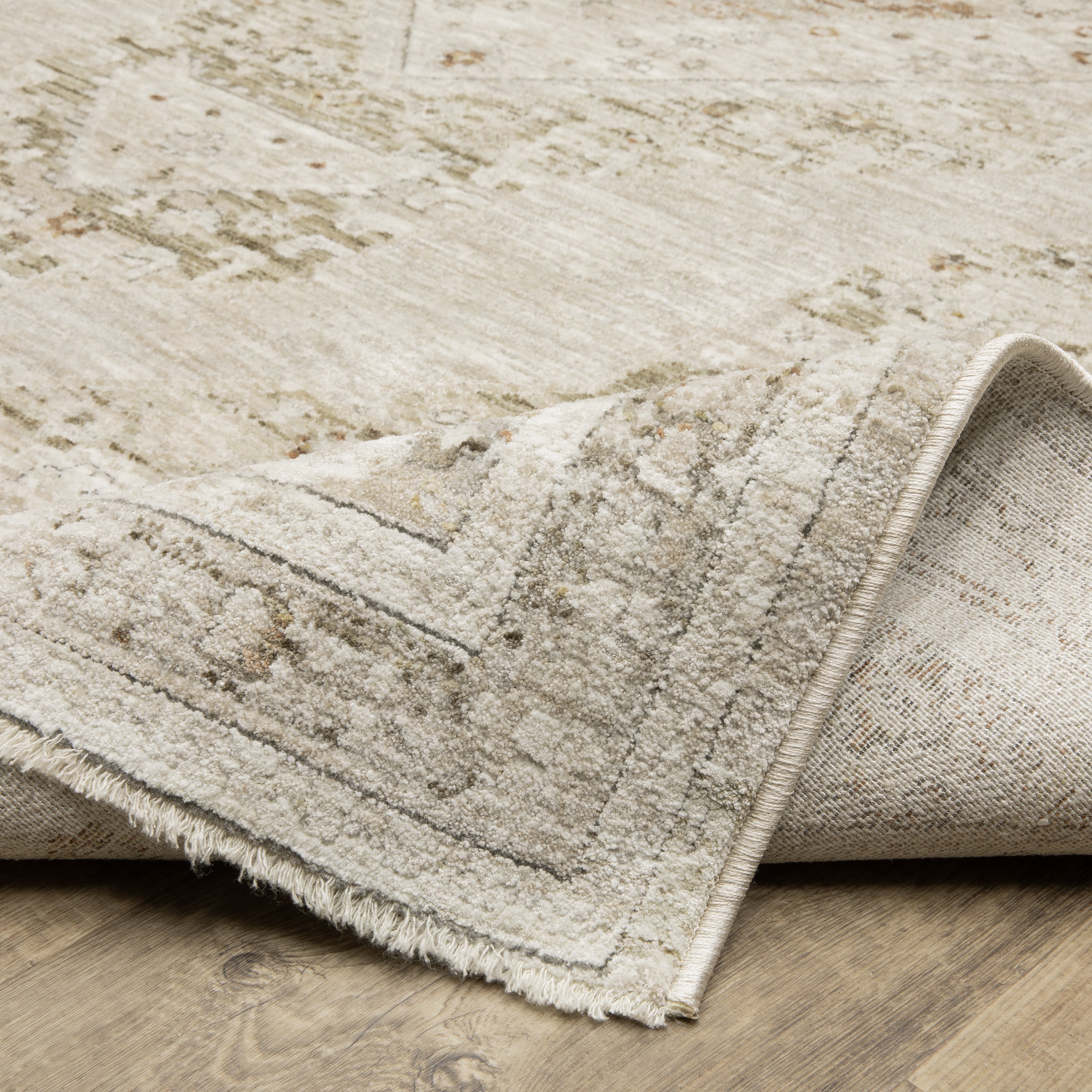 Oriental Weavers Avalon AVA06 soft transitional rug featuring decorative pattern in beige/ ivory tones