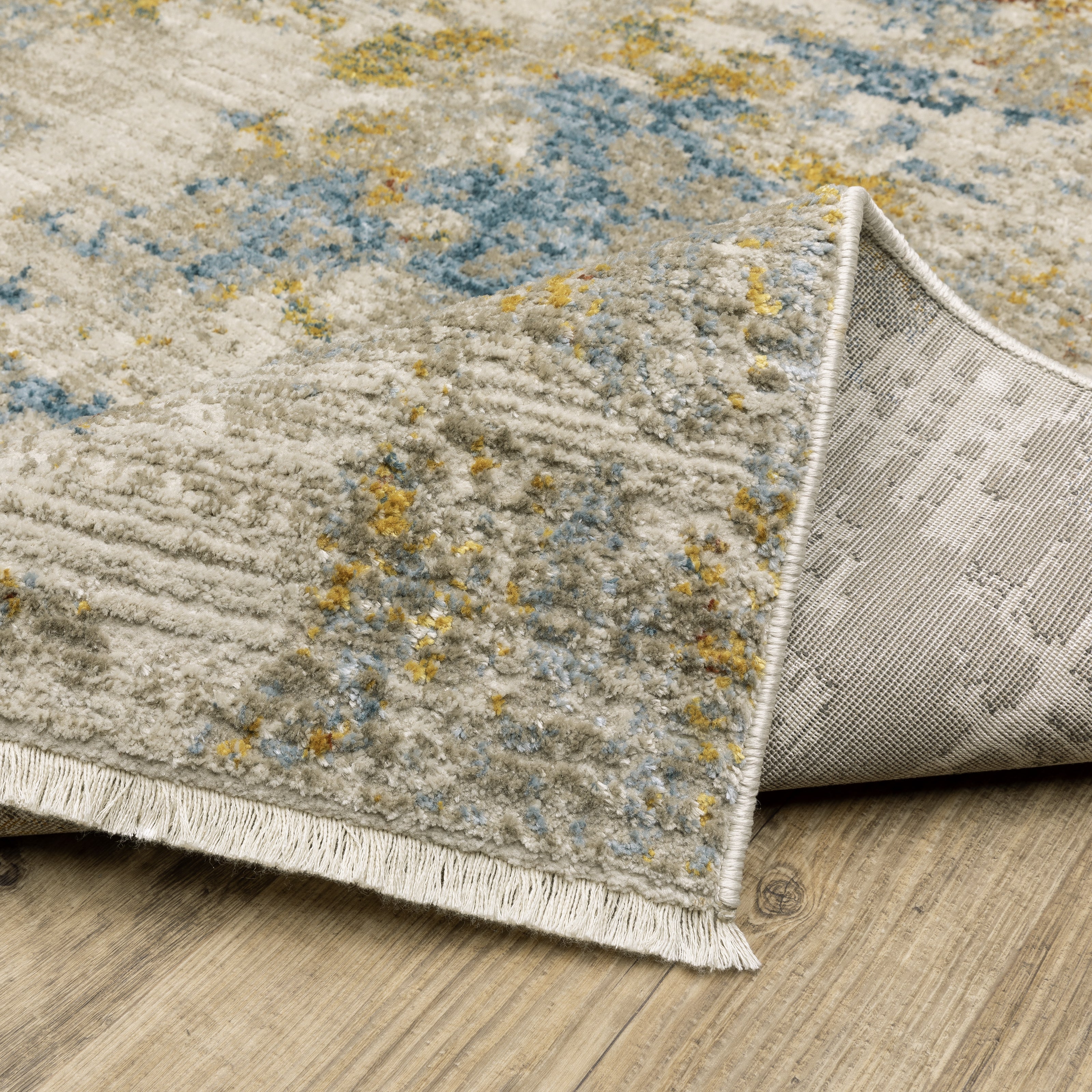 Oriental Weavers Bauer 1340W plush modern rug featuring abstract pattern in beige/ multi tones