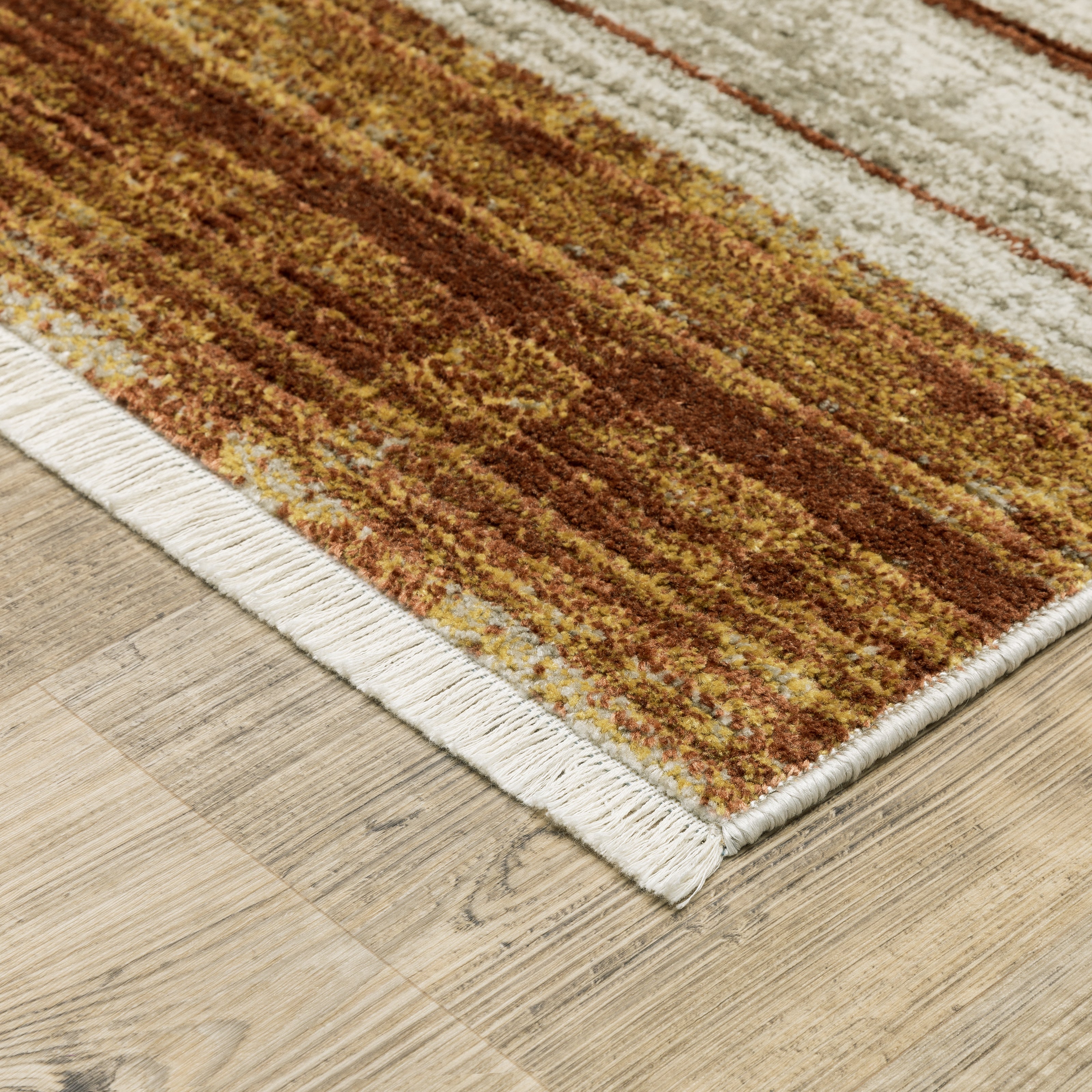 Oriental Weavers Bauer 090R2 plush modern rug featuring abstract pattern in rust/ gold tones