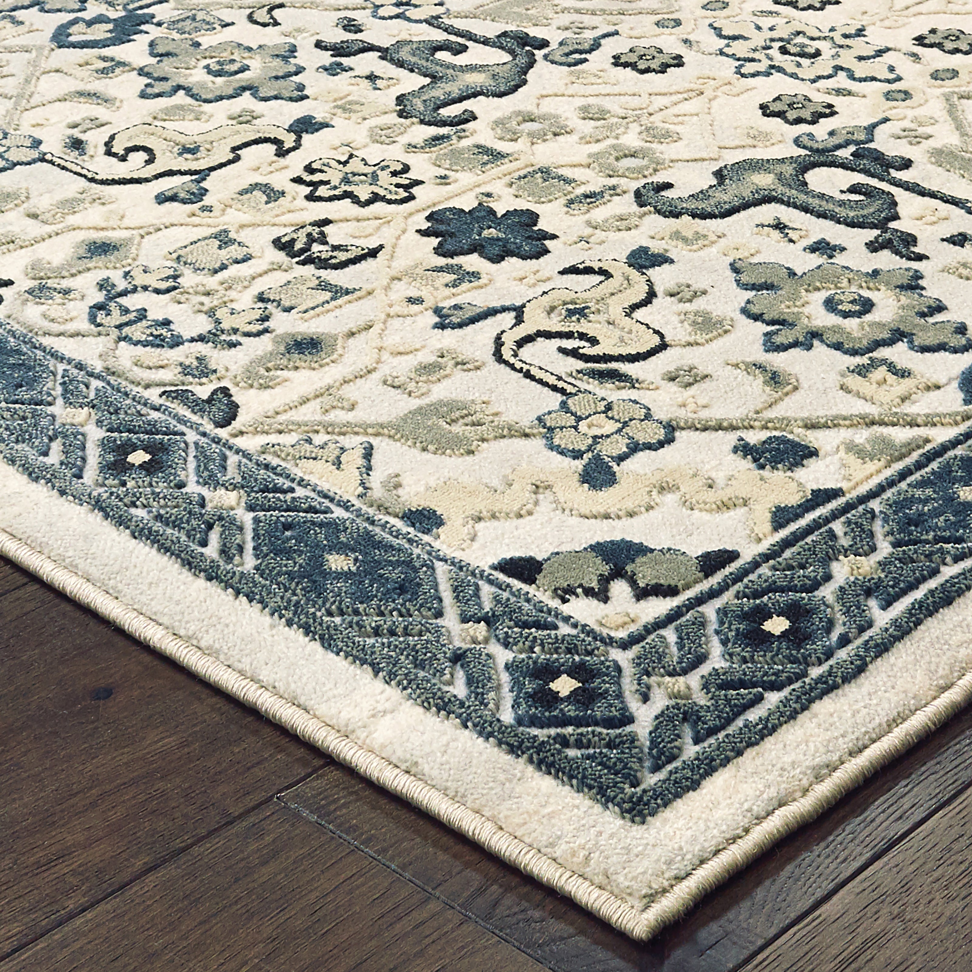 Oriental Weavers Bowen 073J2 soft transitional rug featuring textured design in ivory/ navy tones