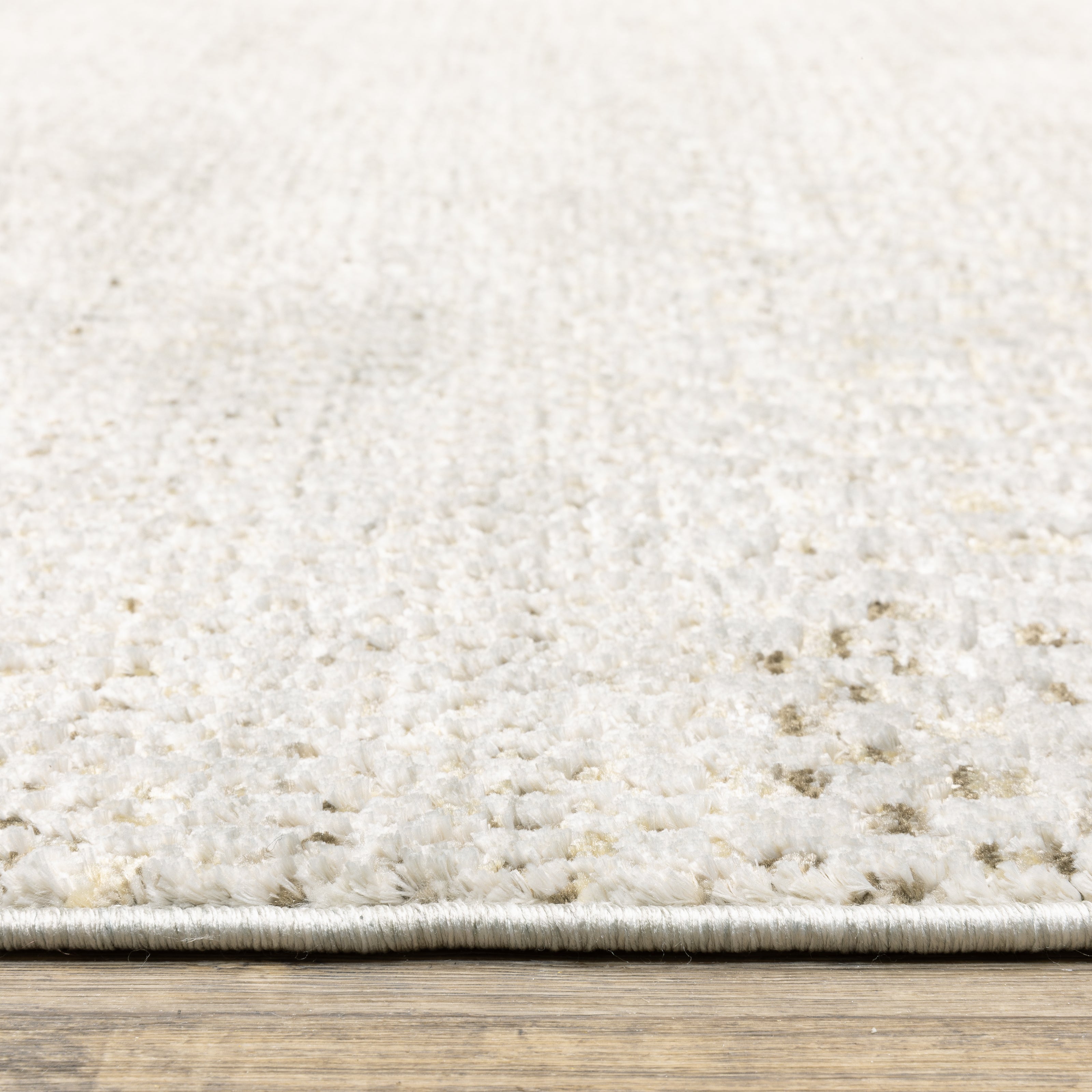 Oriental Weavers Branigan BRG06 soft modern rug featuring abstract pattern in ivory / gold tones