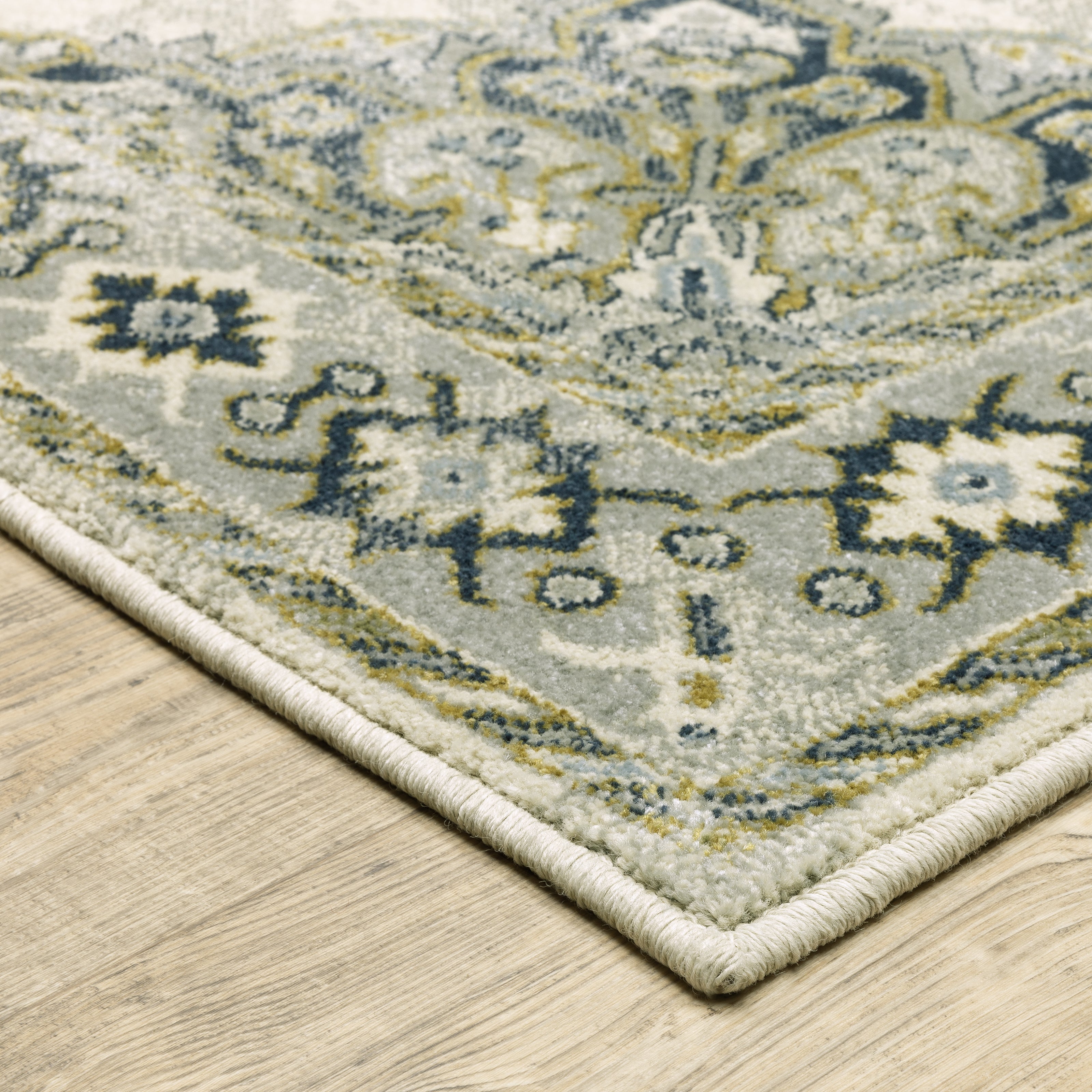 Oriental Weavers Branson BR04B soft transitional rug featuring textured design in ivory/ blue tones