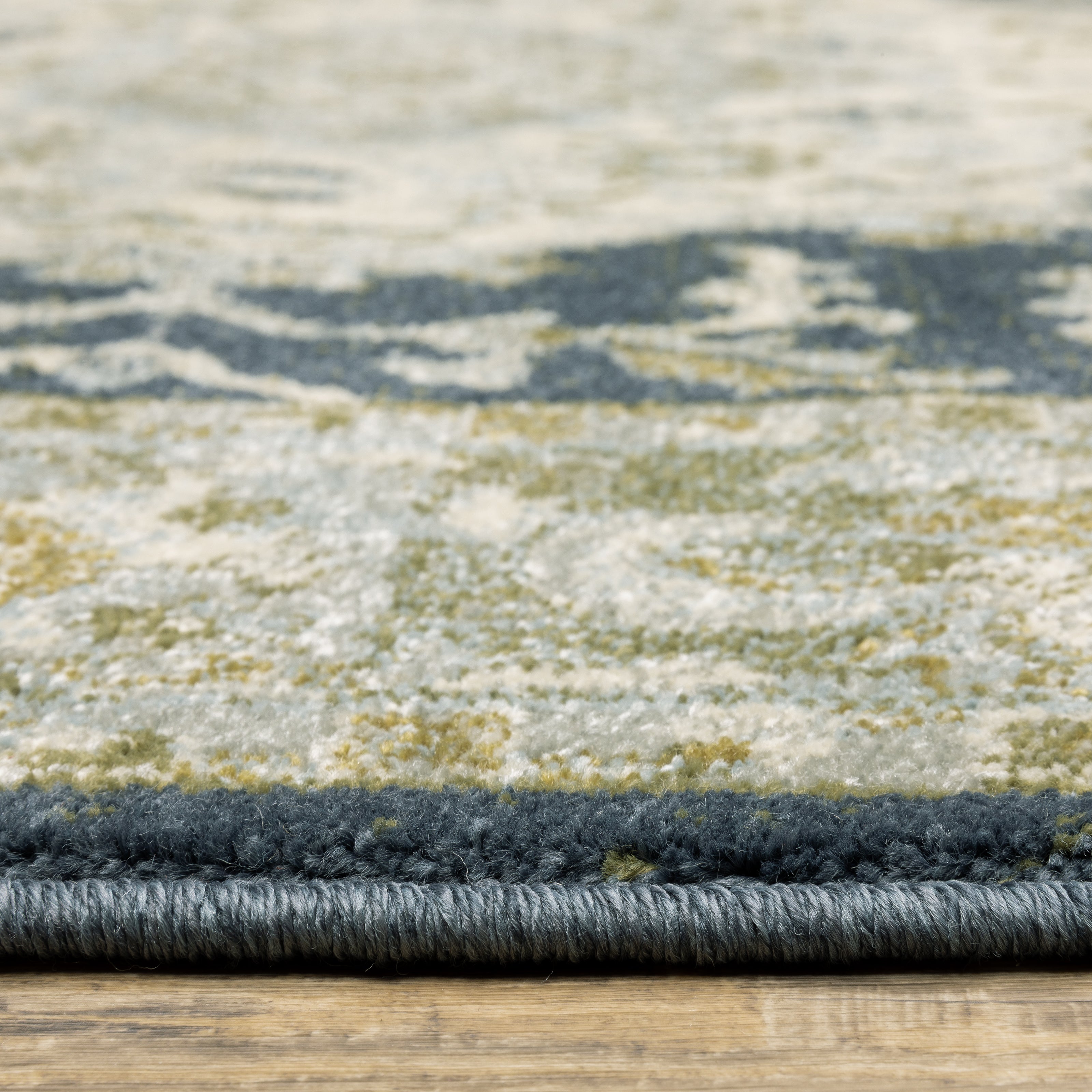 Oriental Weavers Branson BR05A soft transitional rug featuring textured design in teal blue/ ivory tones