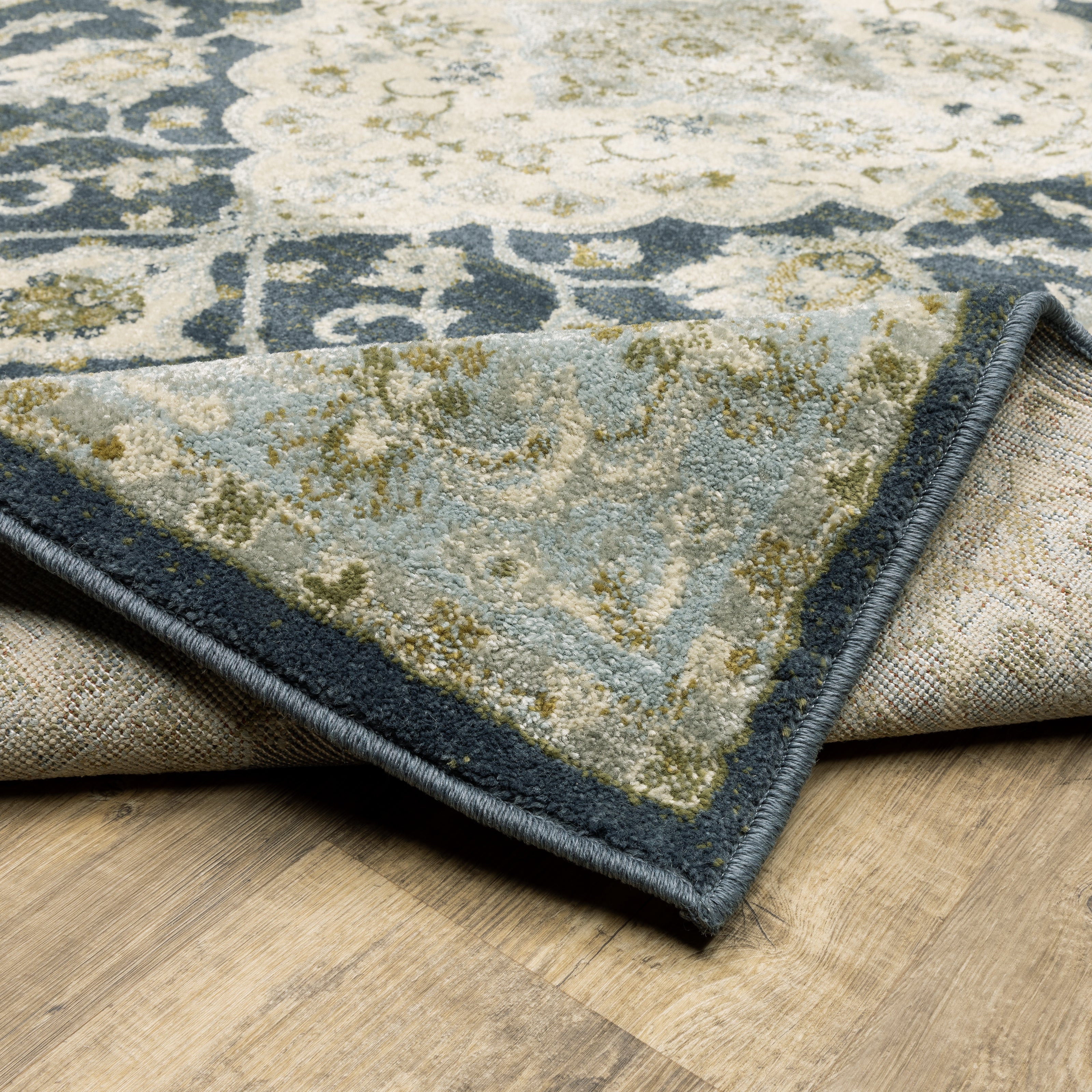 Oriental Weavers Branson BR05A soft transitional rug featuring textured design in teal blue/ ivory tones