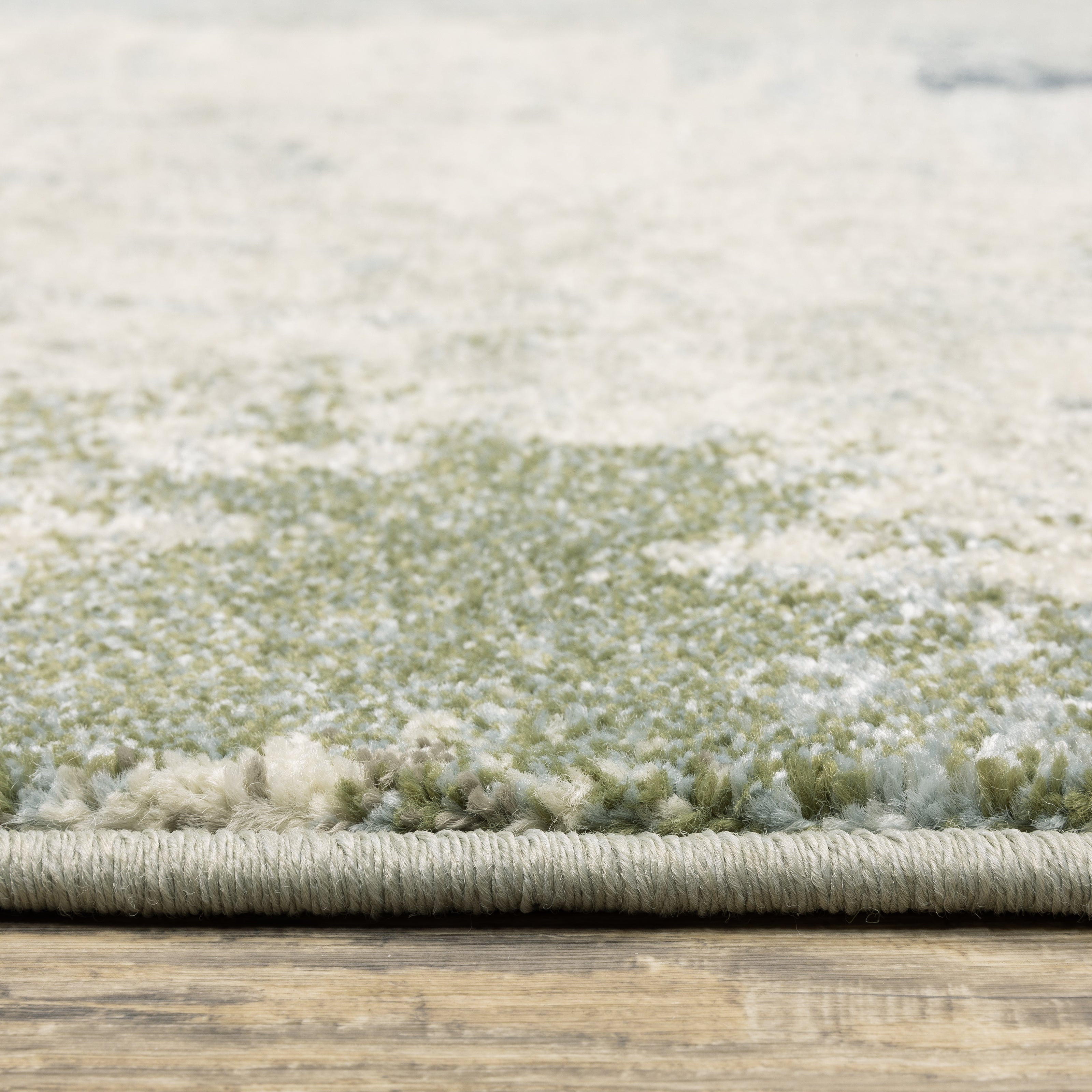 Oriental Weavers Branson BR08A soft transitional rug featuring textured design in blue/ green tones
