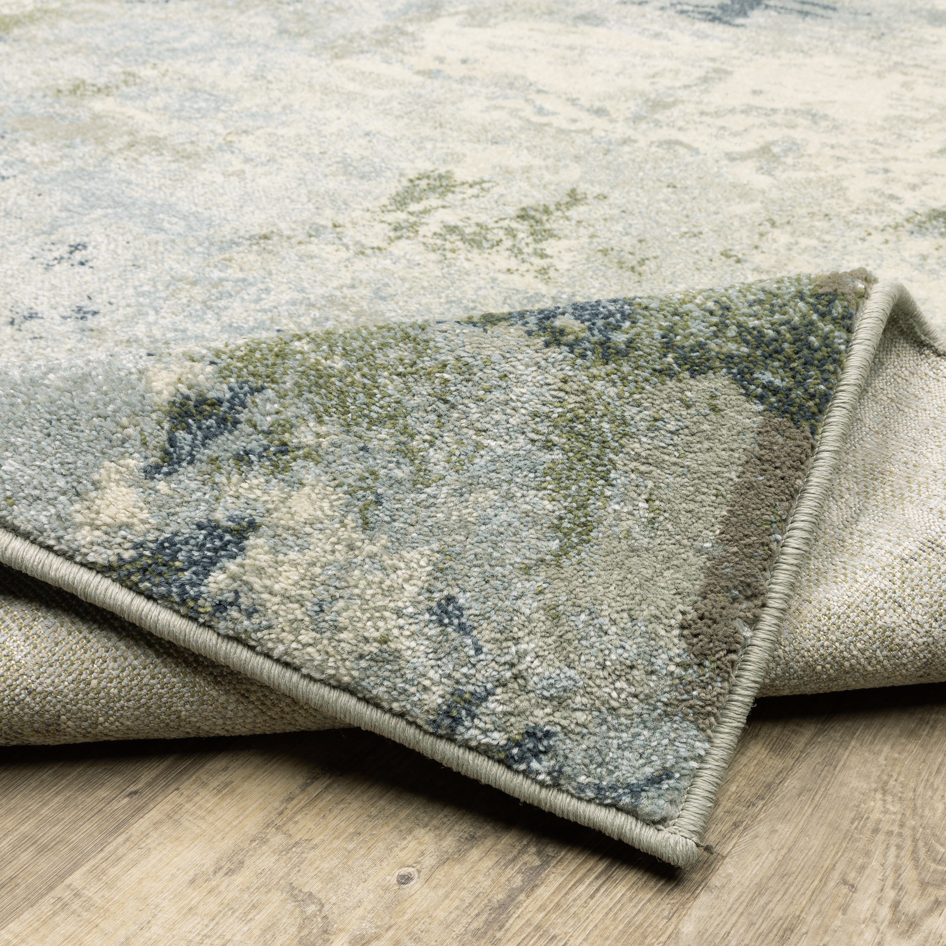 Oriental Weavers Branson BR08A soft transitional rug featuring textured design in blue/ green tones