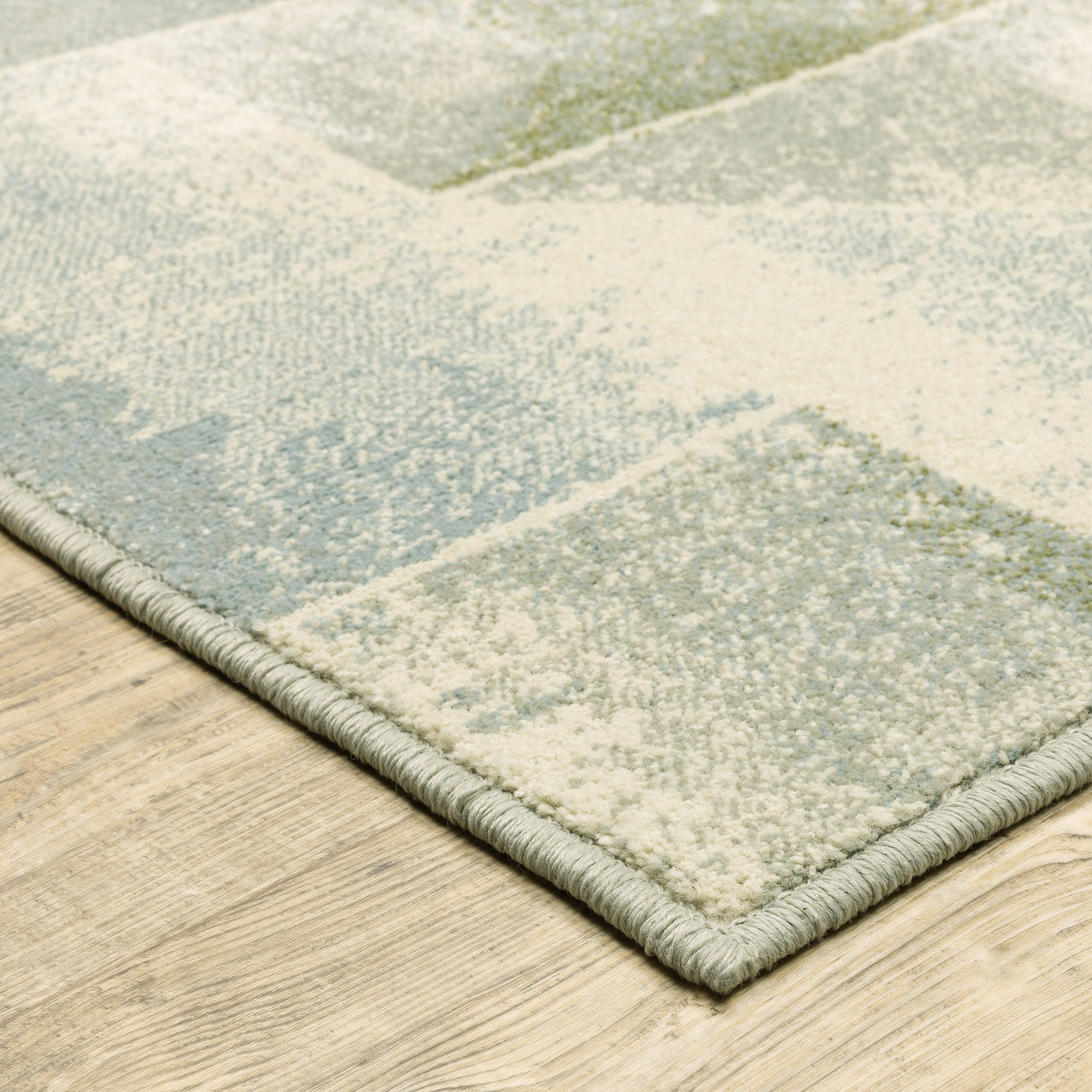 Oriental Weavers Branson BR10A soft transitional rug featuring textured design in blue/ green tones