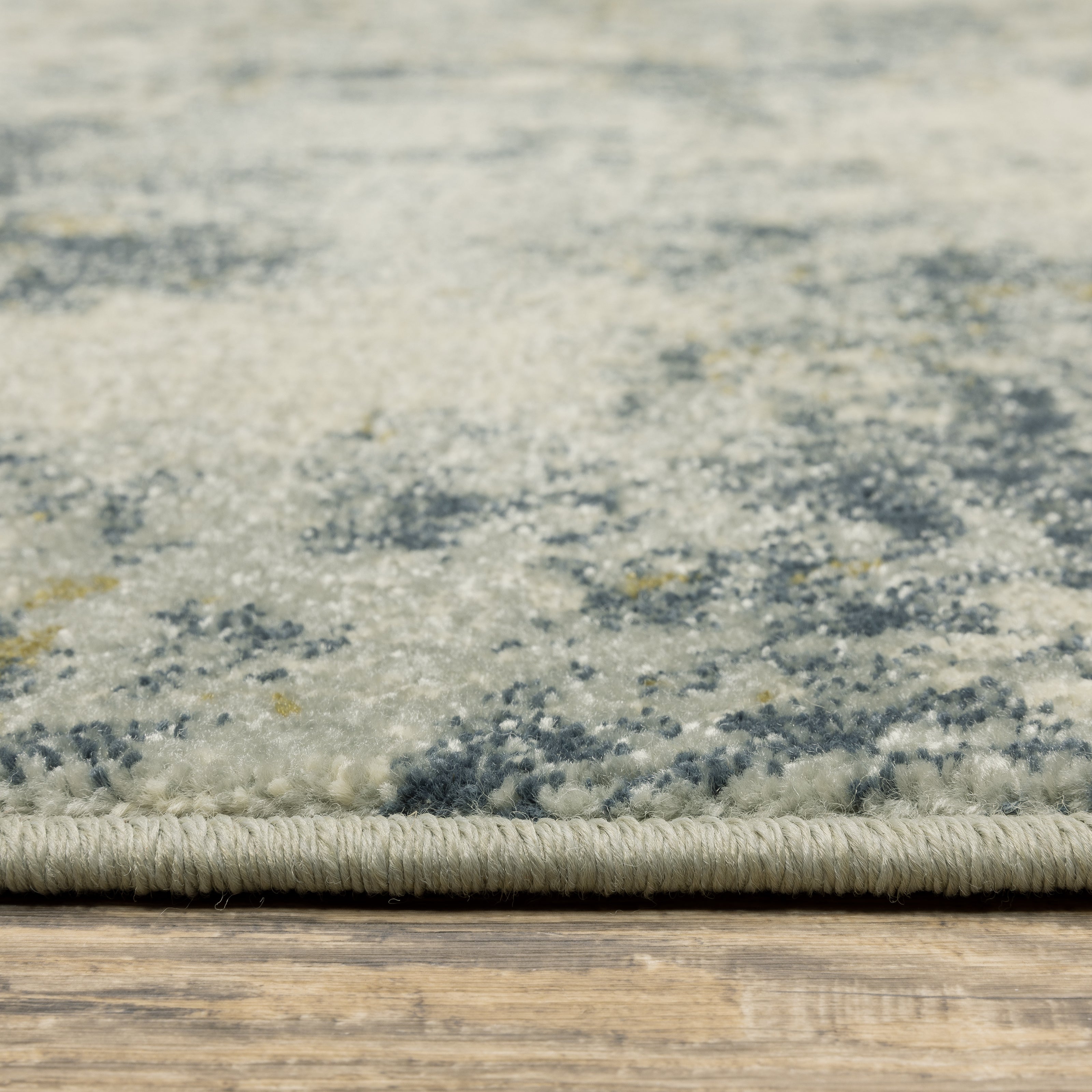 Oriental Weavers Branson BR12A soft transitional rug featuring textured design in beige/ teal tones
