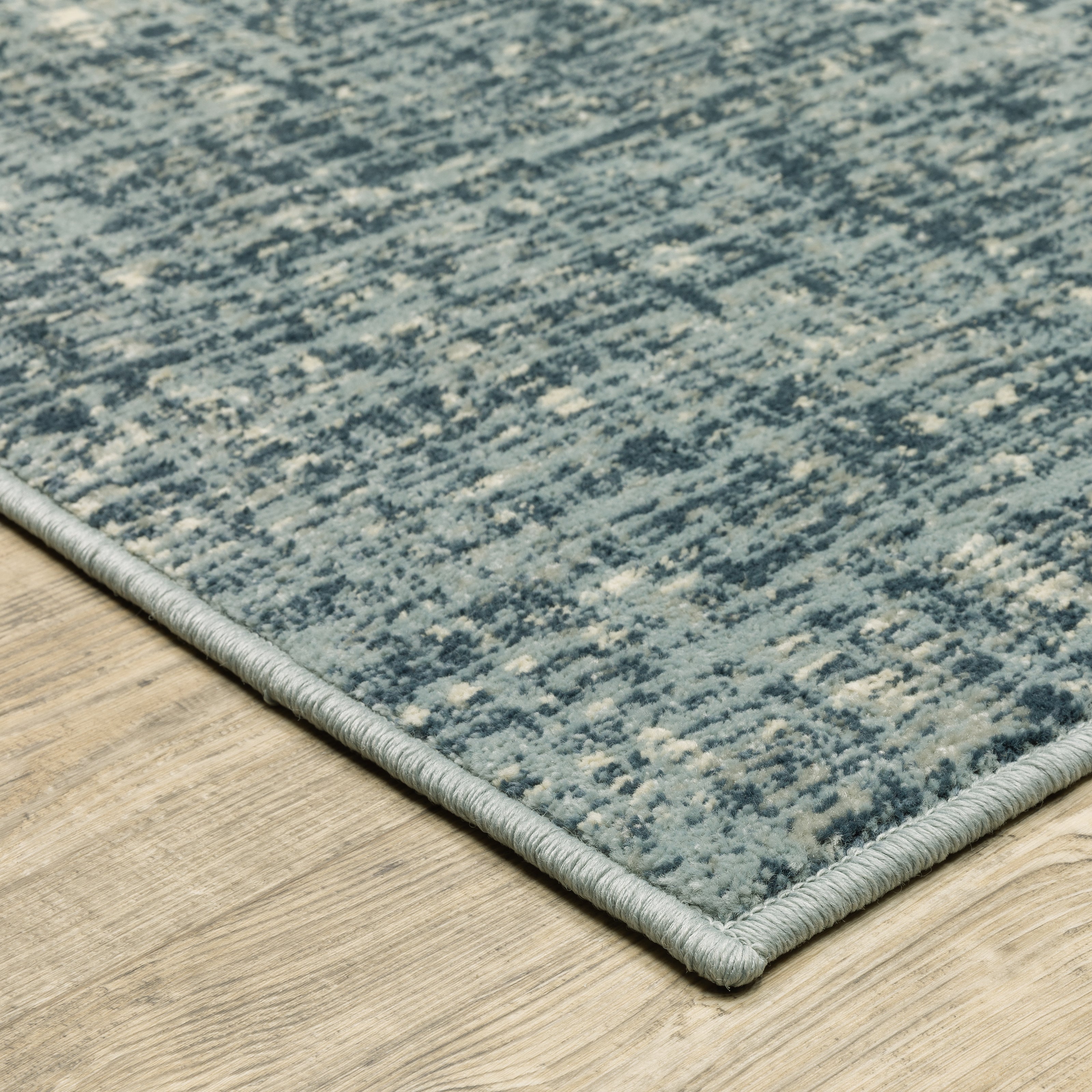 Oriental Weavers Branson BR13A soft transitional rug featuring textured design in blue/ grey tones
