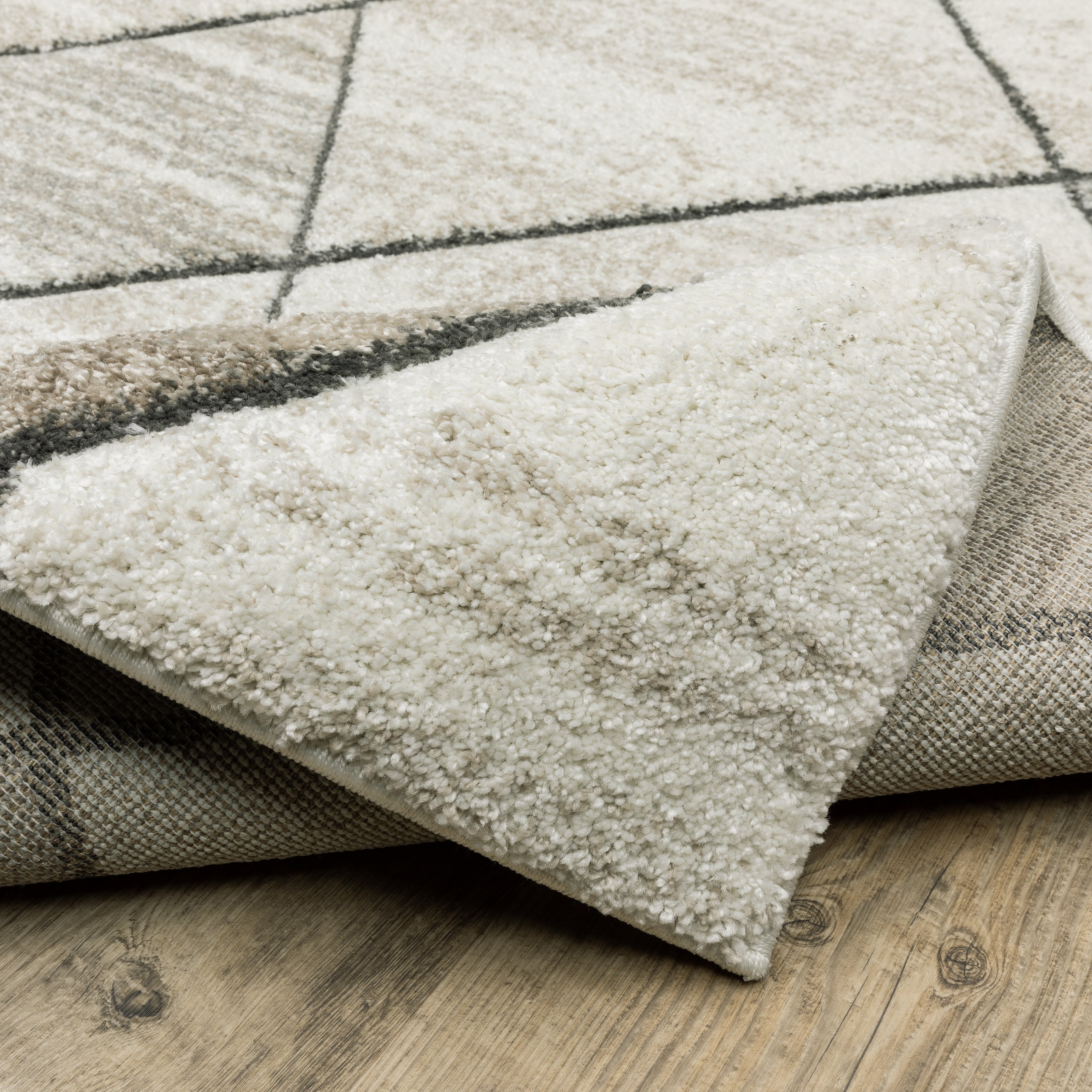 Oriental Weavers Cambria 4928A plush modern rug featuring abstract pattern in beige/ grey tones