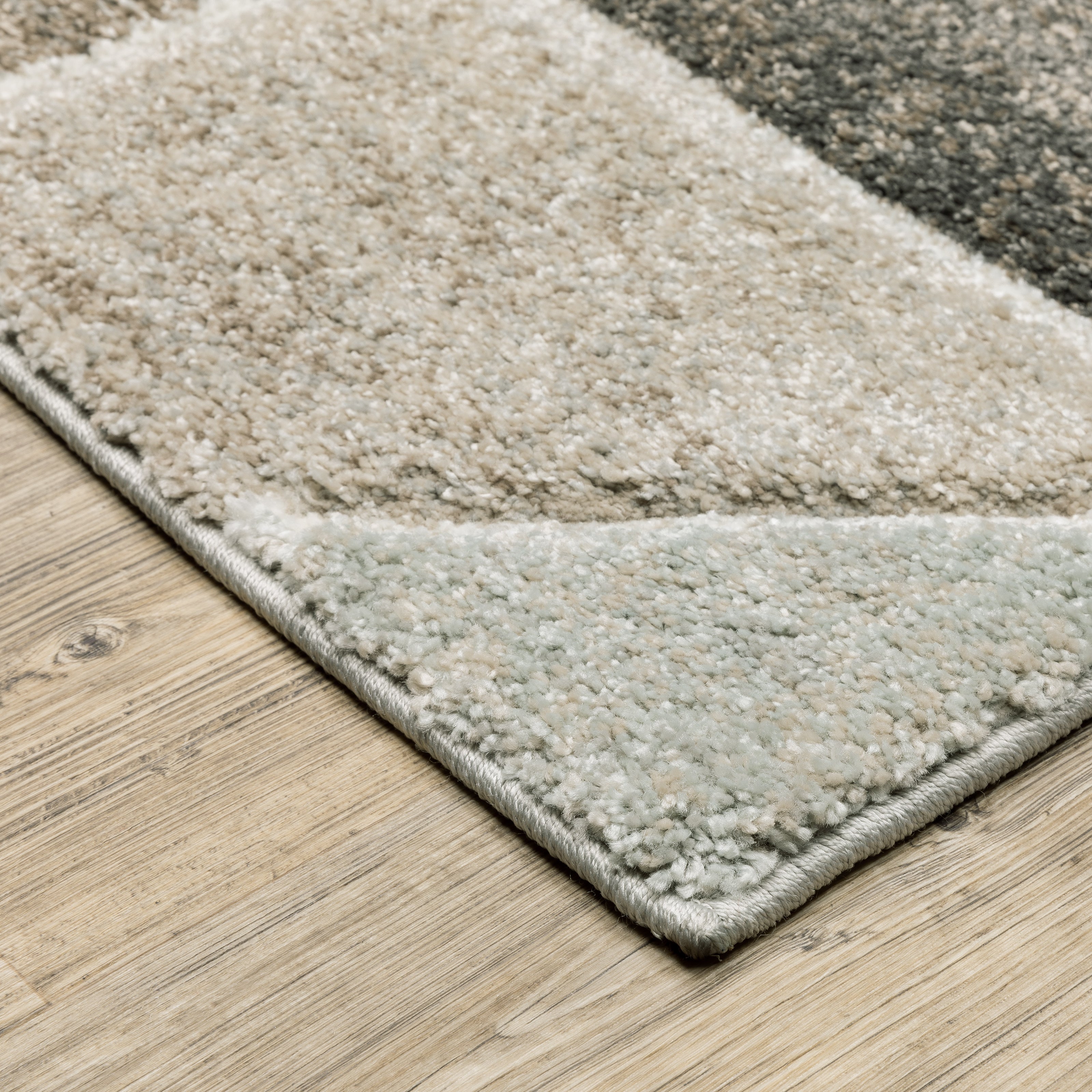 Oriental Weavers Cambria 004L2 plush modern rug featuring abstract pattern in grey/ brown tones