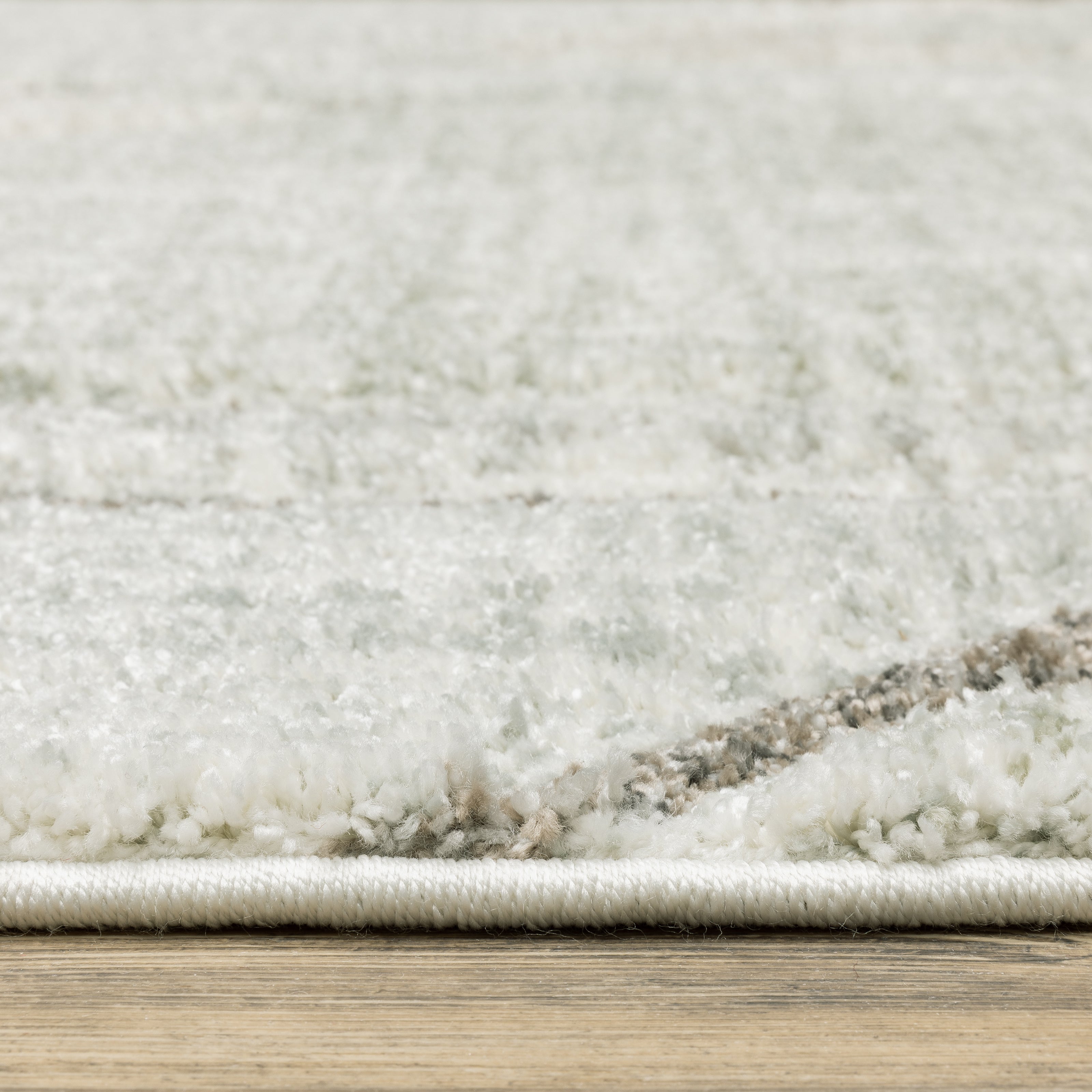 Oriental Weavers Cambria 5569B plush modern rug featuring abstract pattern in grey/ beige tones