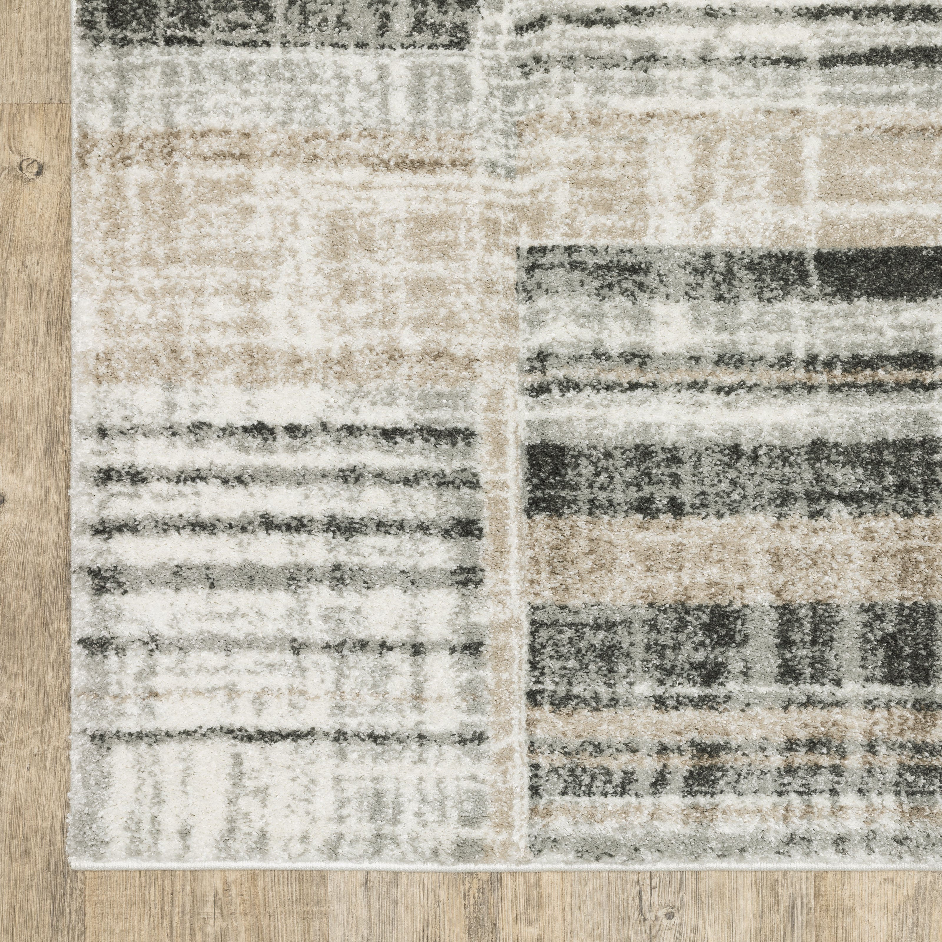 Oriental Weavers Cambria 055X2 plush modern rug featuring abstract pattern in tan/ charcoal tones